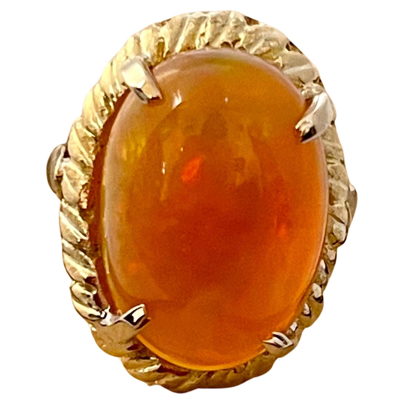 A Huge Cocktail ring 
Approximately 14 Carat Oval Ethiopian Opal  & Diamond Ring 14 Karat Yellow Gold Size 6.5
This spectacular Ring consisting of a single Oval Shape Ethiopian Opal Approximately 14 Carat. 

very clean Stone no inclusion , full of
