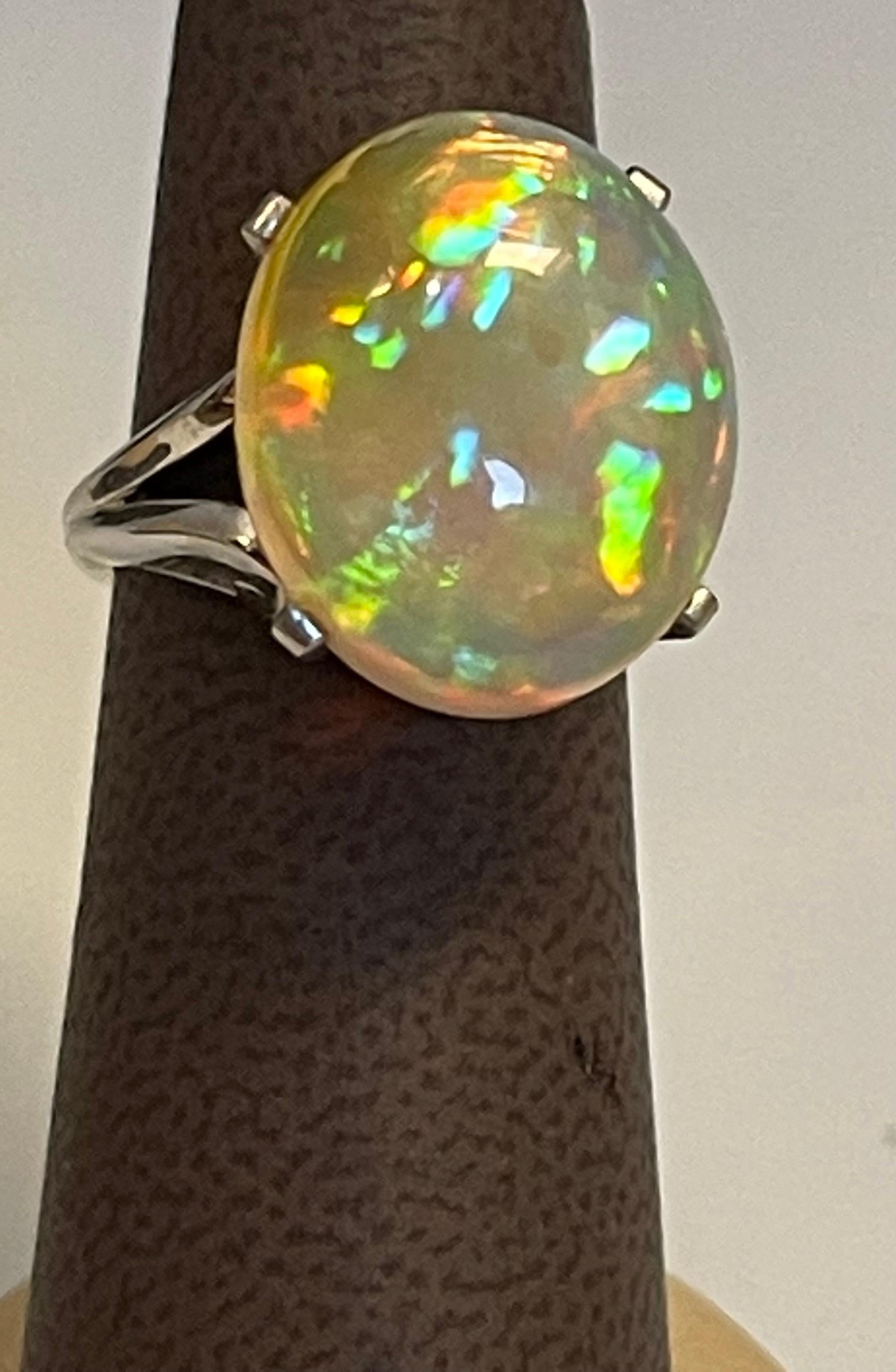 14 Carat Oval Shape Ethiopian Opal  Cocktail Ring in Platinum Size 6
Oval  Natural Opal  A classic, Cocktail ring 
Estate
Size of the opal 14X10X6 MM, Approximately 14 ct

Huge Opal clean and Good quality  in Oval in shape , luster and shine is