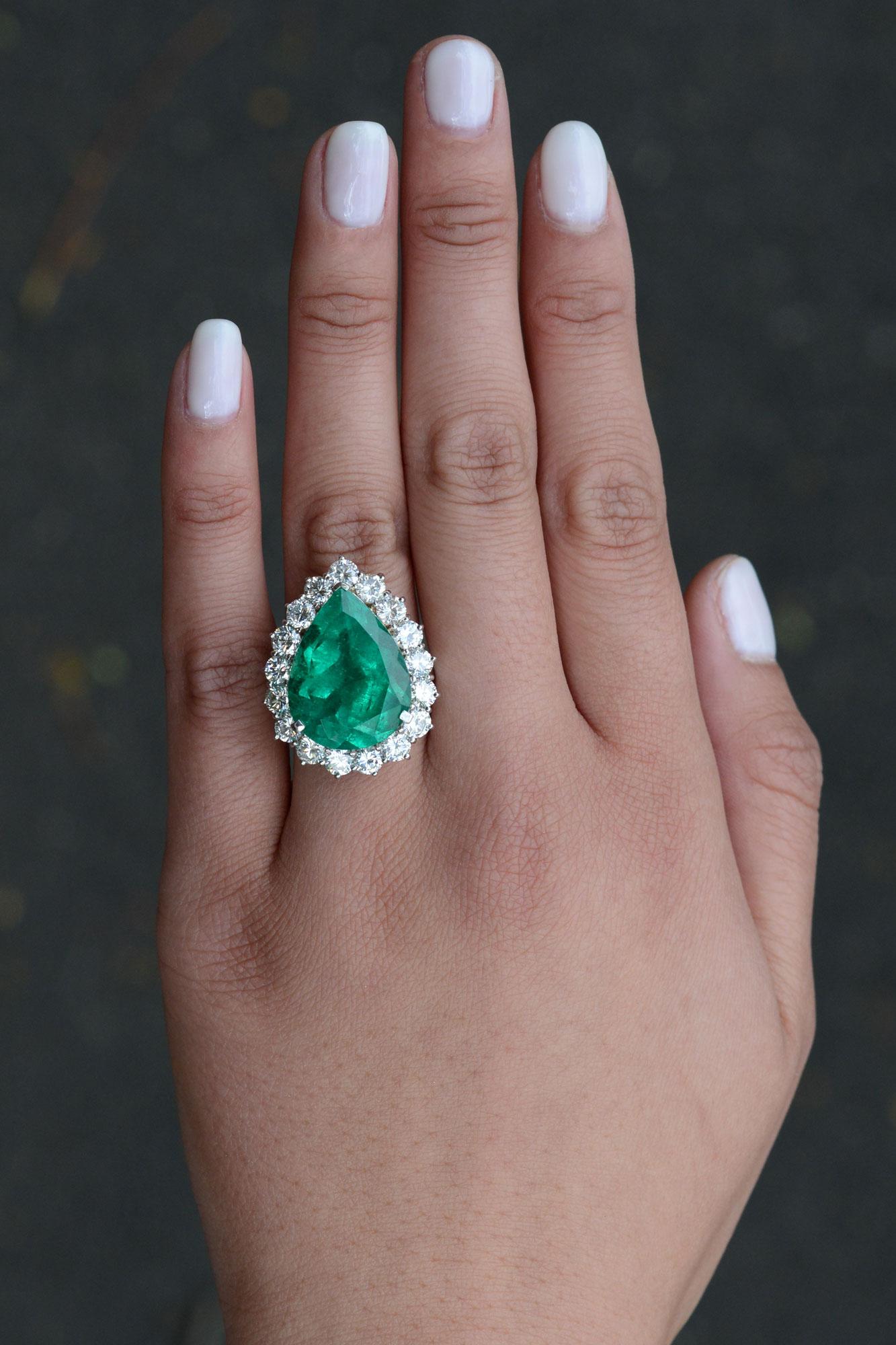 It's rare to find a Colombian emerald of such a significant size (14.07 carats) and pear shape. A mind mellowing, glowing, luxuriant and verdant color described by Pliny The Elder as the purest green in nature. The 1970s vintage platinum cocktail