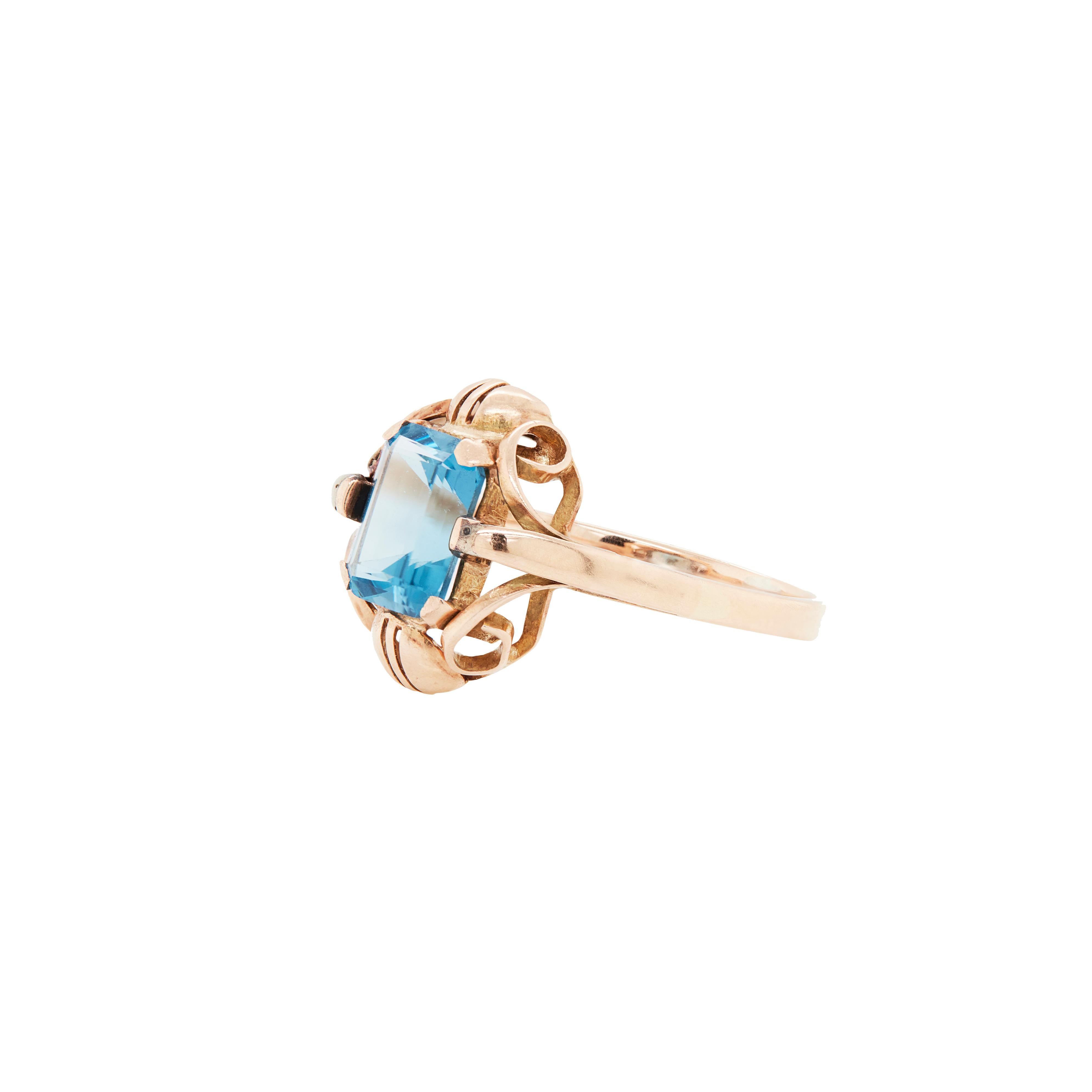 Whether it's for yourself or for a loved one, this gorgeous European, 1930s to 1940s topaz ring is the perfect gift. 

This ring is simply beautiful. Set in rose gold, the head of the ring has a wonderful design, with a stunning gallery beneath the