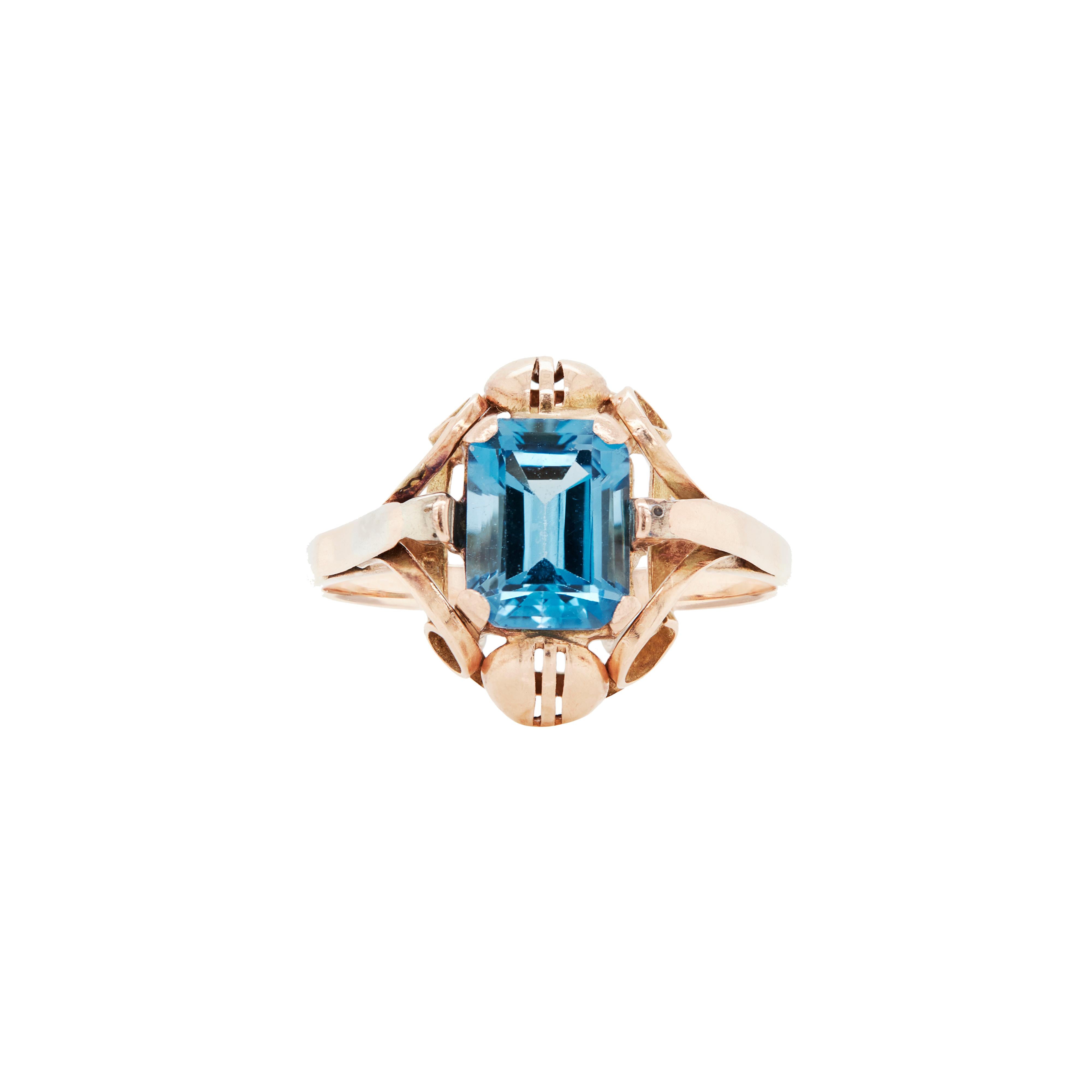 Emerald Cut 14 Carat Rose Gold and Blue Topaz Dress Ring, Circa 1930s-1940s For Sale