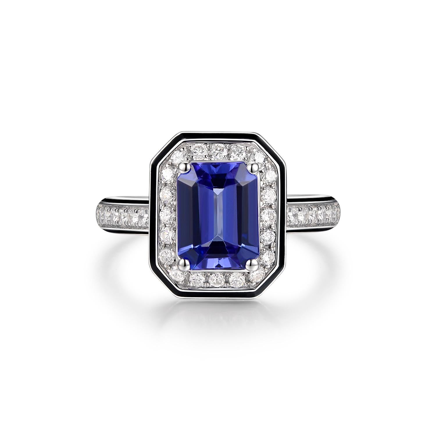 This stunning piece features 1.40 carats of emerald cut tanzanite in the center. The main stone is assented with a diamond halo then outlined with black enamel. A classic yet modern design. 
Matching earrings are available, please visit our