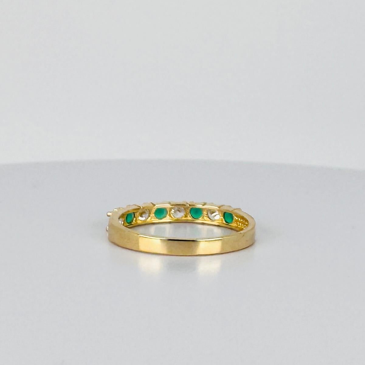 14 carat yellow gold bang ring with white sapphires and emerald 0.16 carat For Sale 6