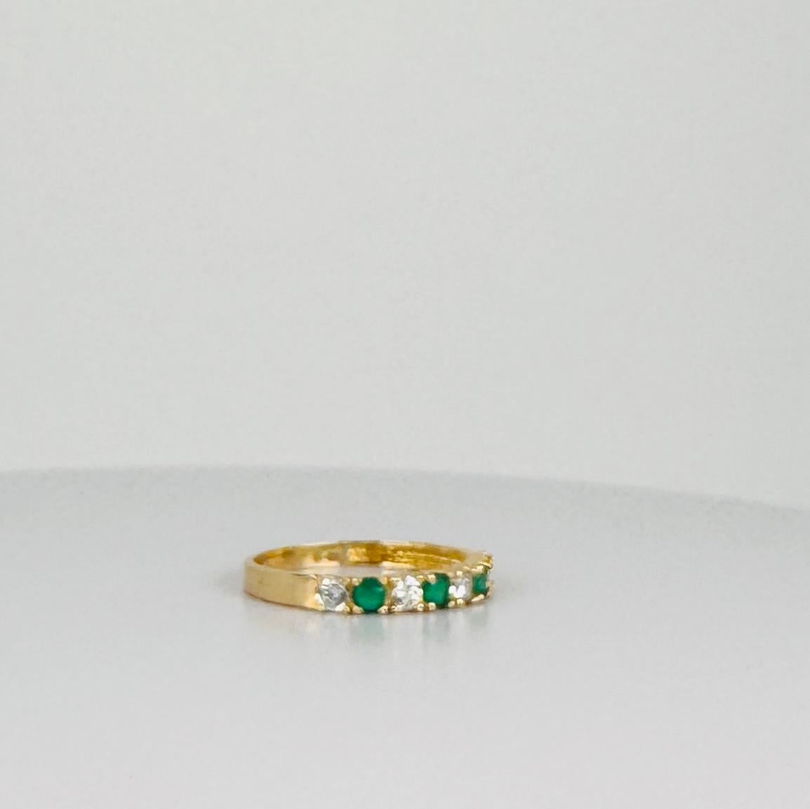 14 carat yellow gold bang ring with white sapphires and emerald 0.16 carat In Good Condition For Sale In Heemstede, NL