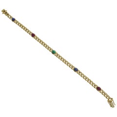 14 Carat Yellow Gold Bracelet with Rubies, Sapphire and Emerald