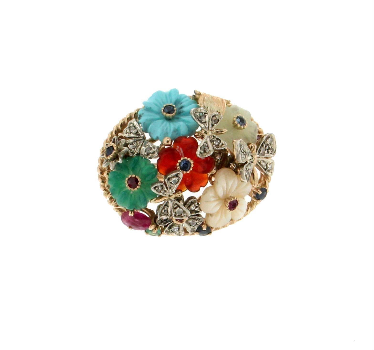 Yellow gold 14 carat and silver 925 carat mounted with diamonds,sapphires,emeralds,rubies and agate turquoise carnelian flowers, cocktail ring

Ring weight 17.90 grams
Diamonds weight 0.40 carat
Ring size 16.80 ITA 8 US