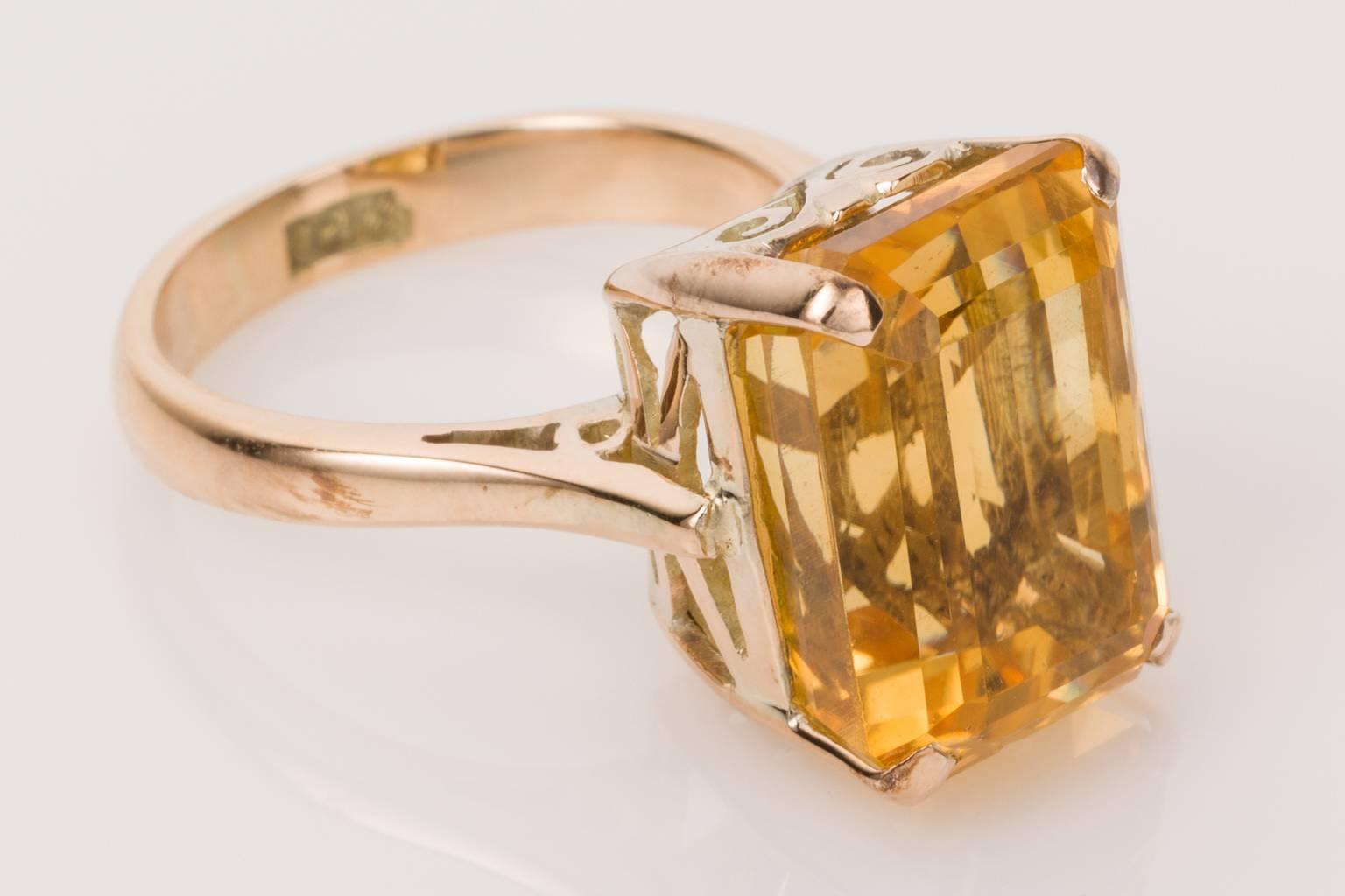 Golden Citrine, such a wonderful statement on the hand. This impressive 14 carat yellow gold ring has a beautiful emerald cut citrine at its centre. A deep cut gemstone showing gorgeous tones of gold and yellow. The estimated weight of the citrine