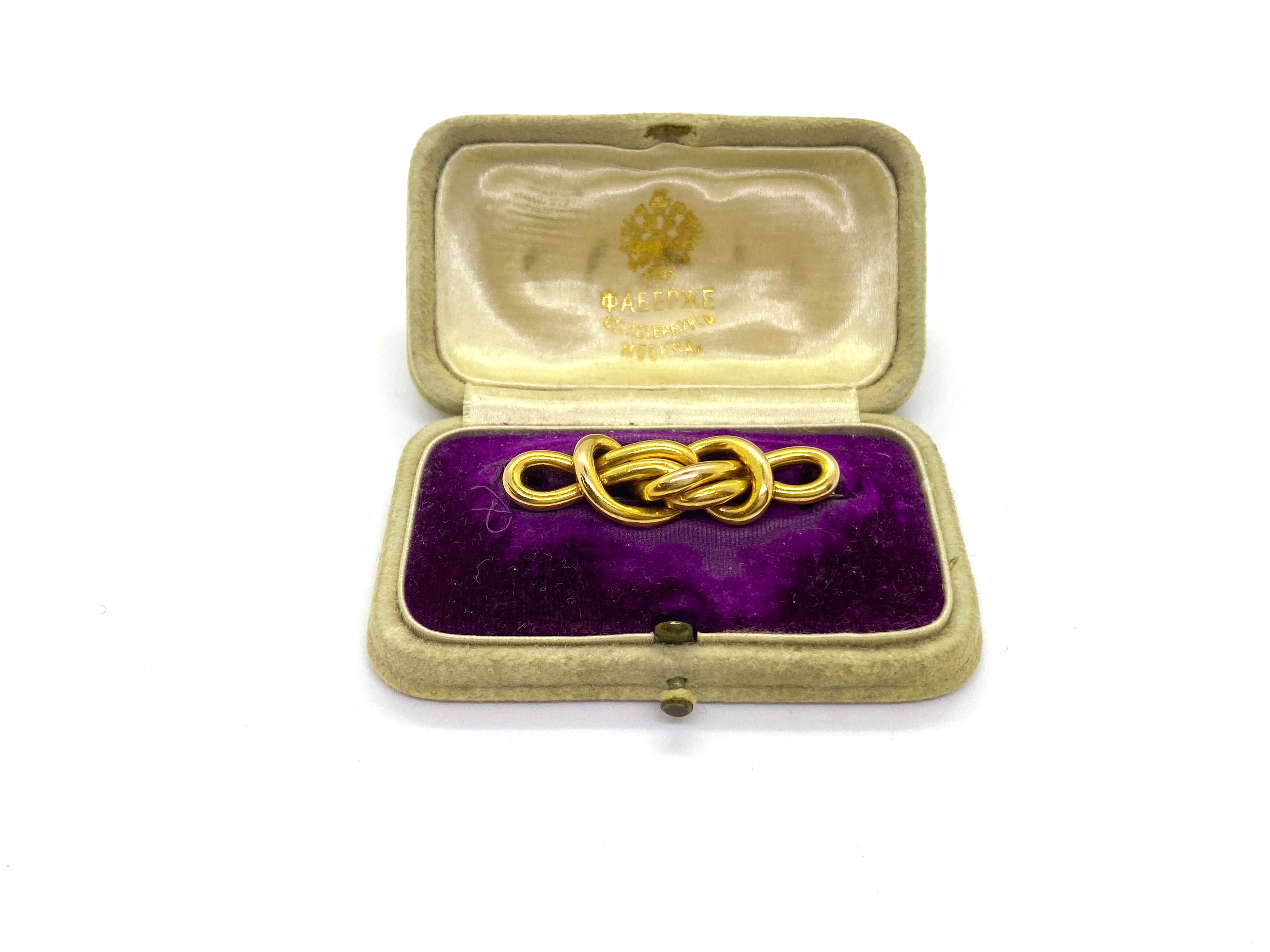 Faberge
14 Carat Yellow Gold Mikhail Perchin Fabergé Knot Brooch
14k, Russian Gold Stamp 56, Master Mikhail Perchin stamp in cyrillic letters
Year circa 1890
Original box, golden stamp inside Fabergé St Petersburg Moscow in cyrillic