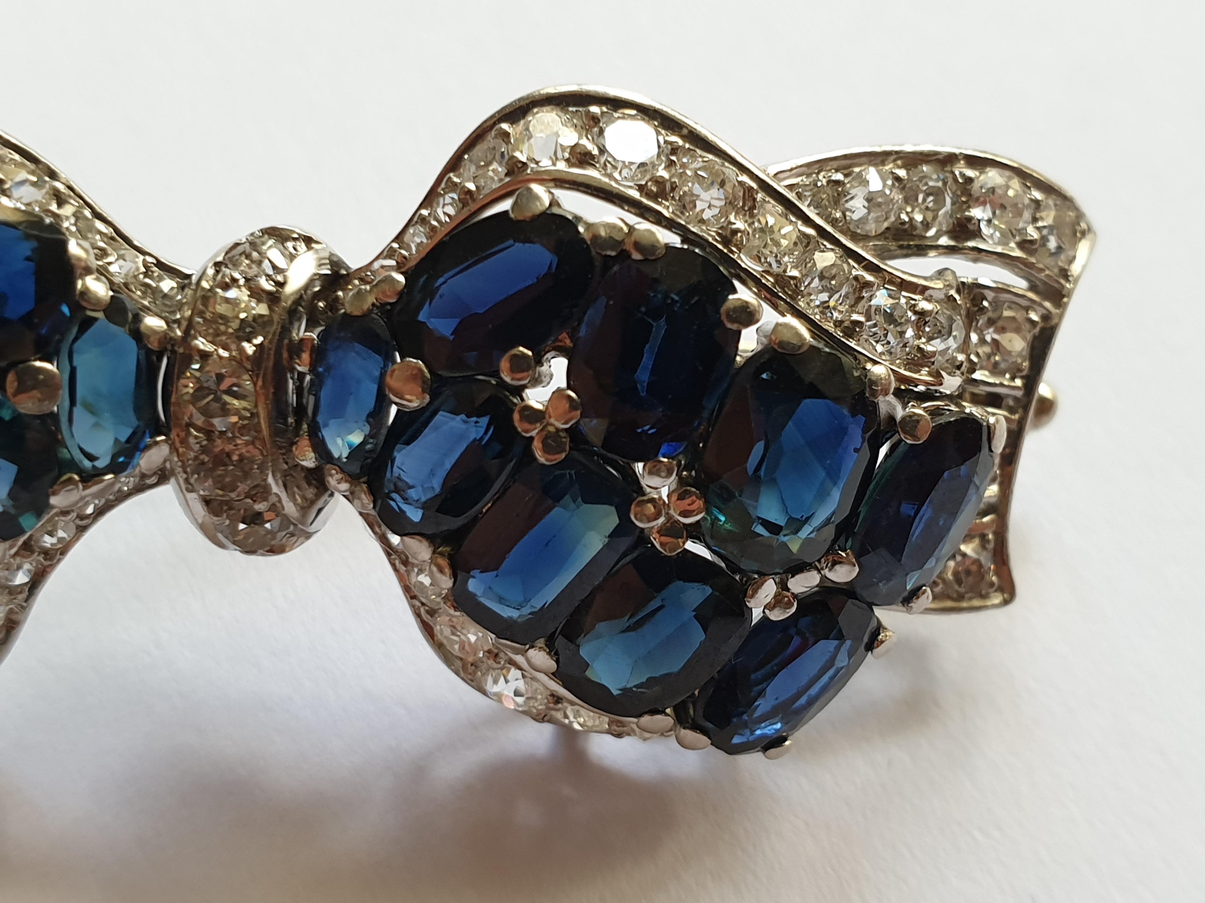 Women's 14 Carat Bow Brooch with Sapphires and Diamonds For Sale