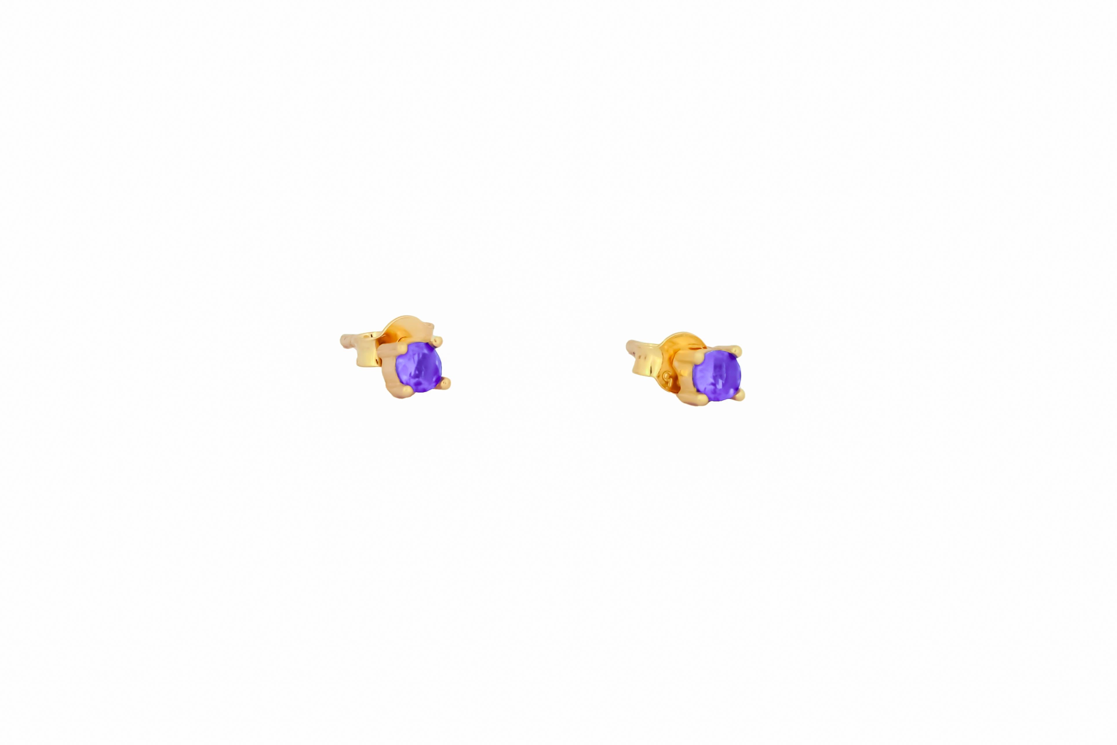 14 ct Gold Lab Amethyst Stud Earrings.  
3 mm amethyst earrings. Purple gemstone earrings. Small delicate gold earrings studs. Four prong studs. Minimalist sapphire earrings.

Metal: 14k solid gold
Weight: 1.5 gr.
Earrings goes with gold