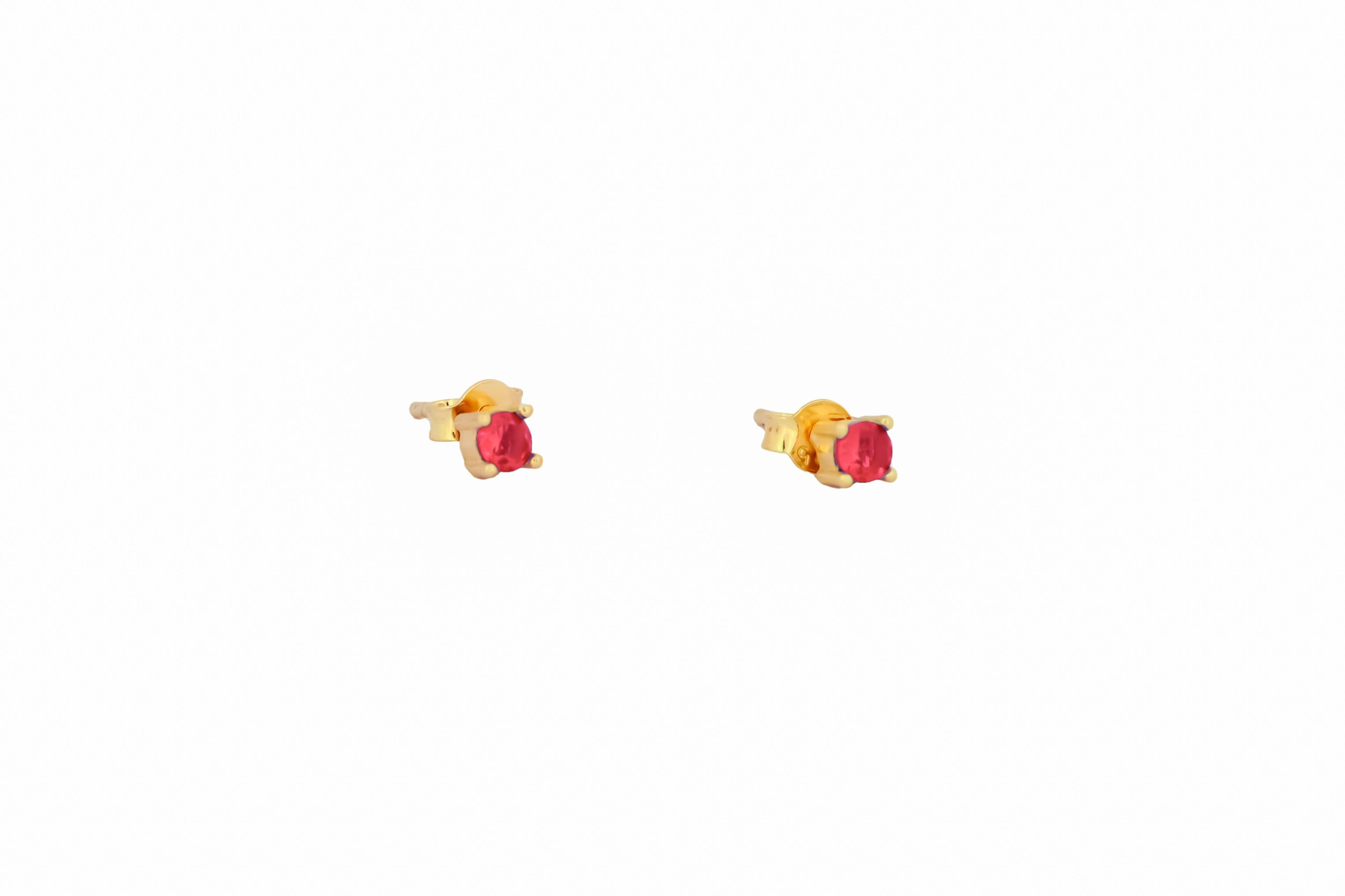 14 ct Gold Lab Ruby Stud Earrings.  
3 mm ruby earrings. Red gemstone earrings. Small delicate gold earrings studs. Four prong studs. Minimalist sapphire earrings.

Metal: 14k solid gold
Earrings goes with gold clasps

Gemstones:
2 red color, round