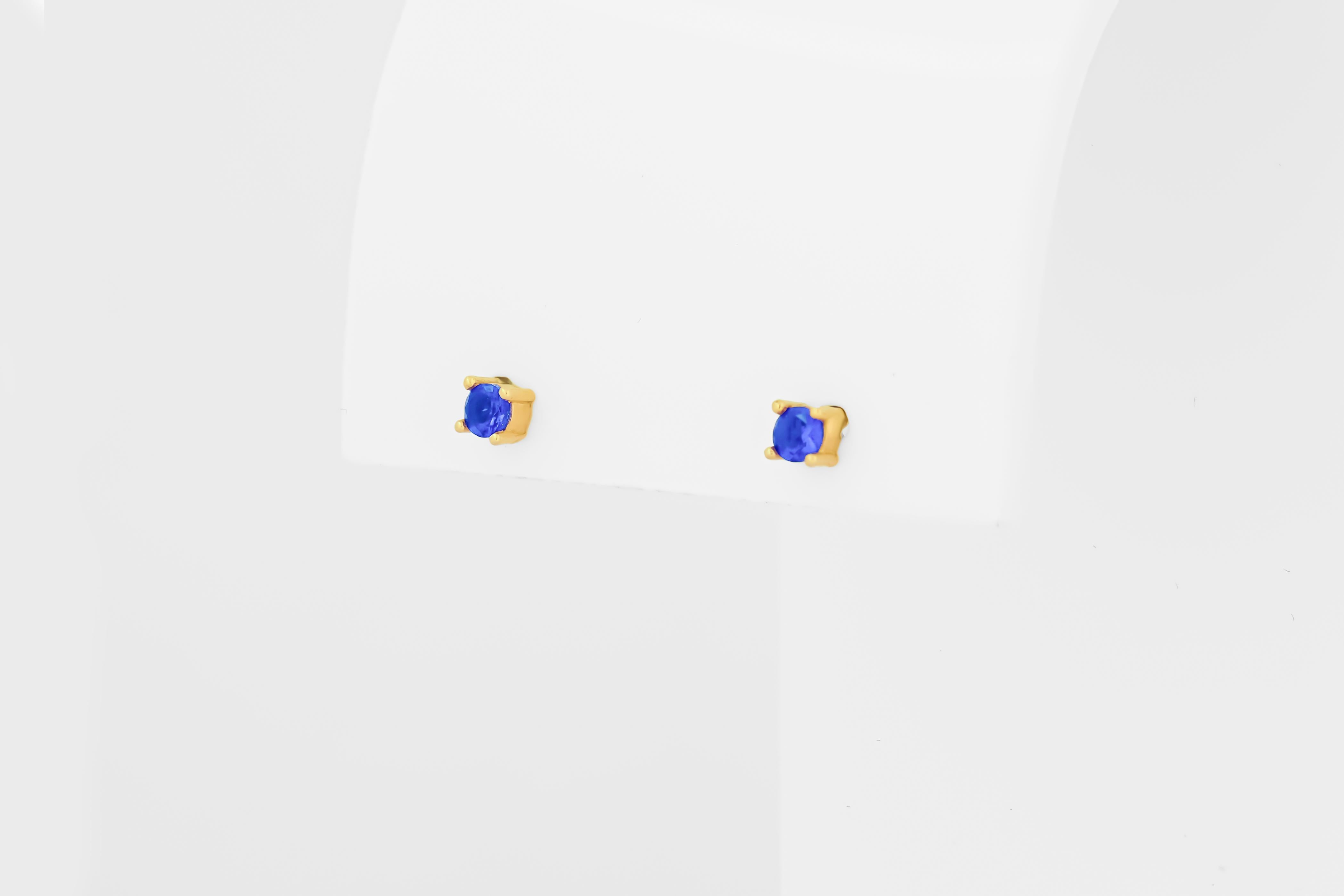 14 ct Gold Lab Sapphire Stud Earrings.  
3 mm sapphire earrings. Blue gemstone earrings. Small delicate gold earrings studs. Four prong studs. Minimalist sapphire earrings.

Metal: 14k solid gold
Weigt: 1.5 gr.
Earrings goes with gold
