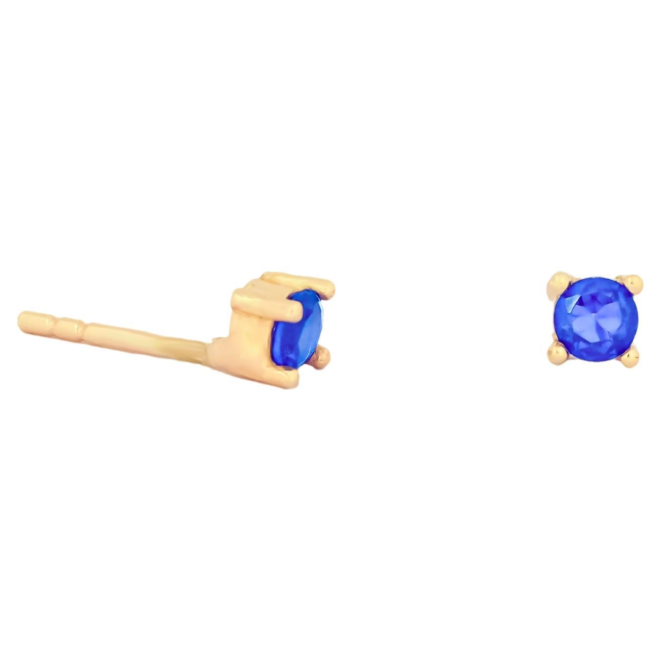 14 ct Gold Lab Sapphire Stud Earrings.   For Sale