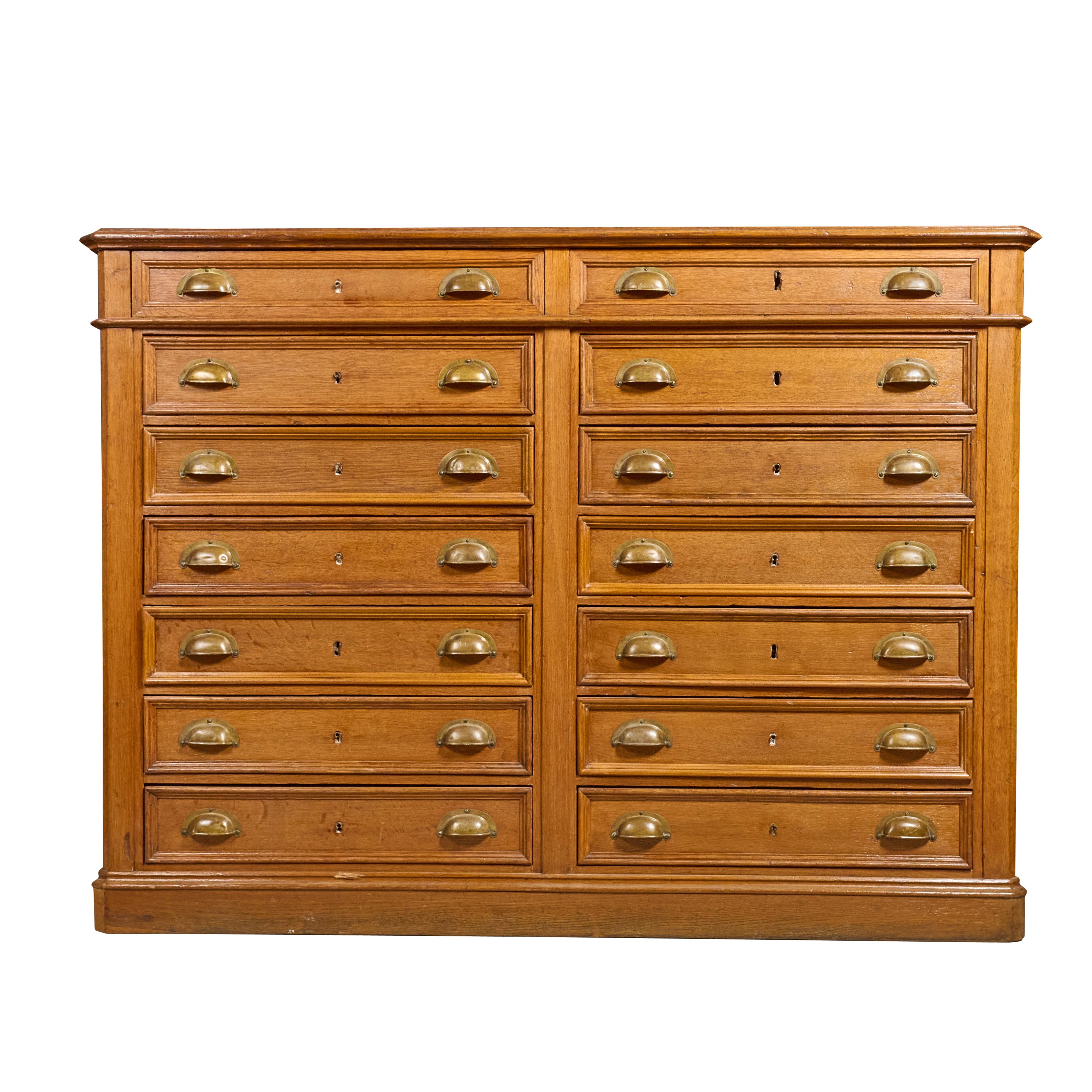 14 drawer oak collections cabinet with brass hardware. Great condition.


