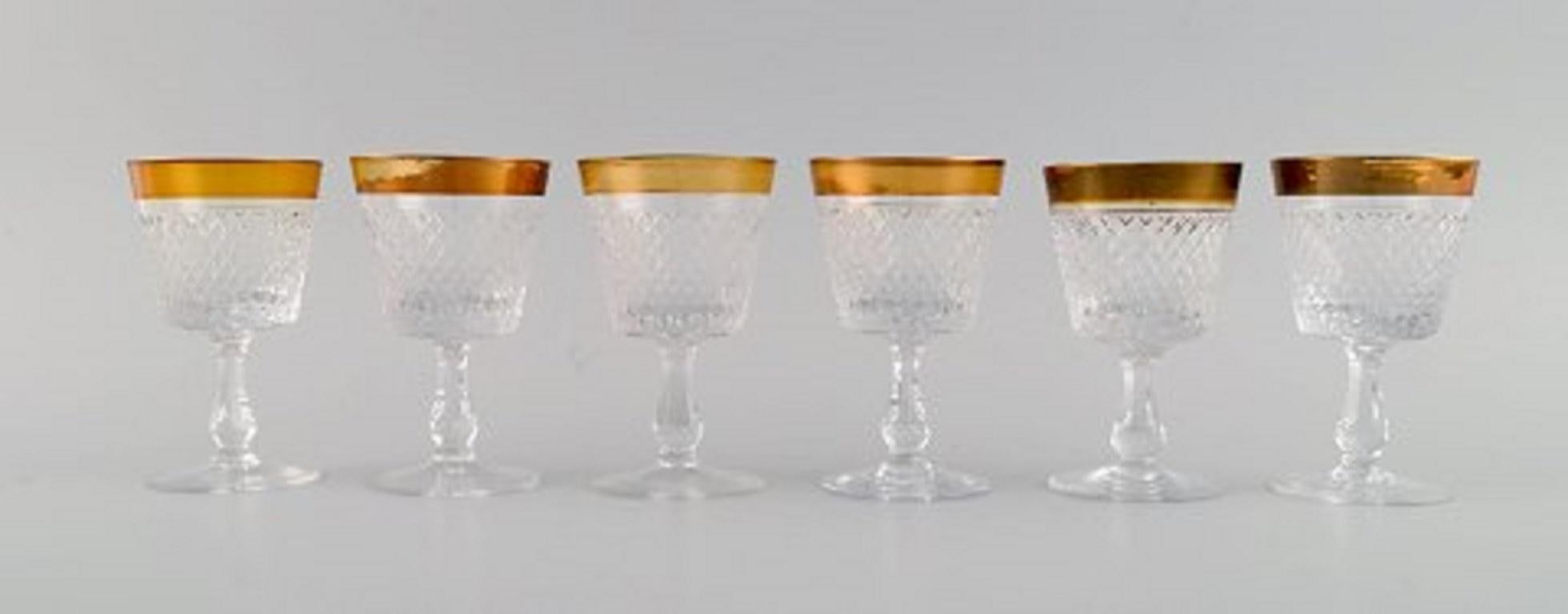 14 glasses in mouth-blown crystal glass with gold edge, France, 1930s.
Consisting of five wine, two champagne and seven sherry glasses.
Champagne glass measures: 16.5 x 6.2 cm.
Sherry glass measures: 10.5 x 6.5 cm.
In excellent condition with