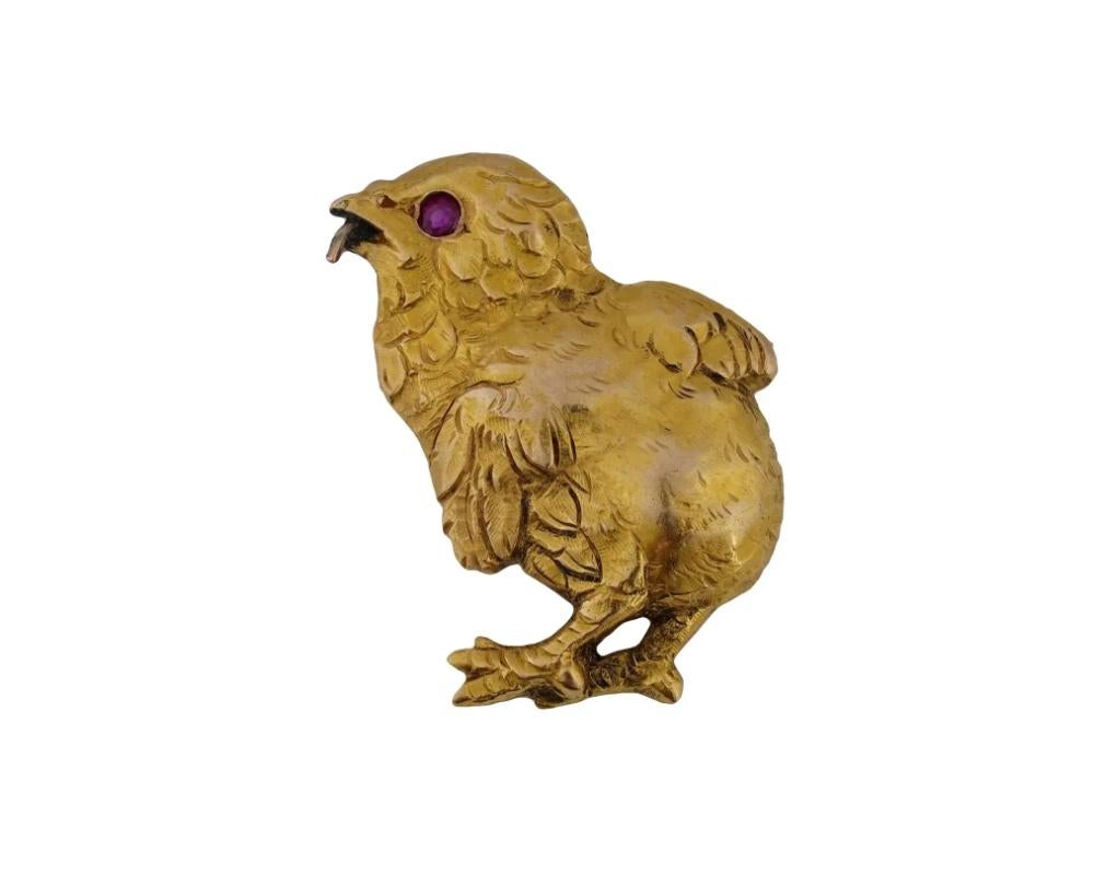 An antique 14K Yellow Gold figural brooch. The brooch is made in a shape of a chick, encrusted with Ruby stone eyes. The brooch is adorned with engraved detailed patterns. Total weight: 8.3 g. Antique and Vintage Gold Jewelry Wares and Accessories
