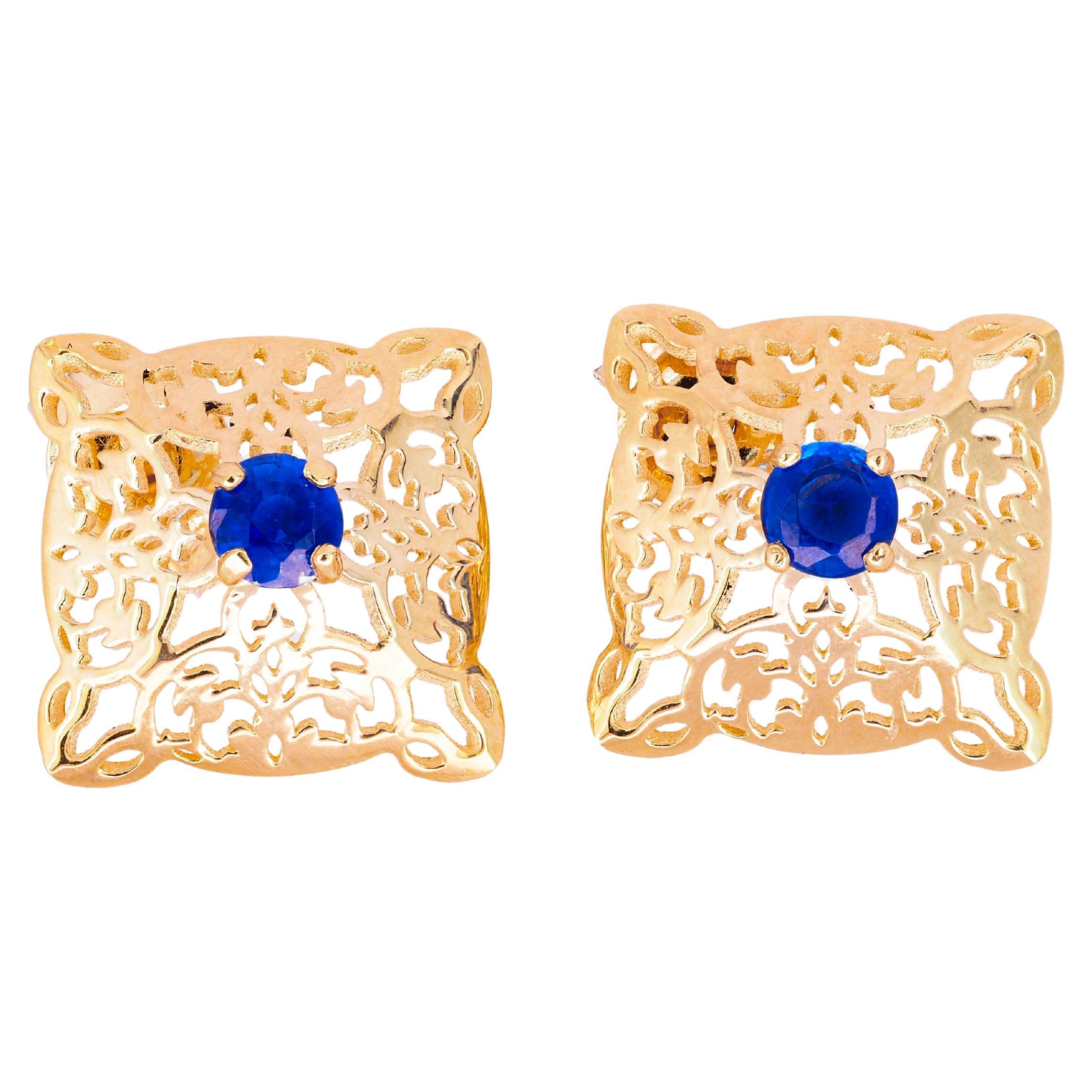 14 K Gold Earrings Studs with Oriental Pattern Set with Central Sapphires For Sale
