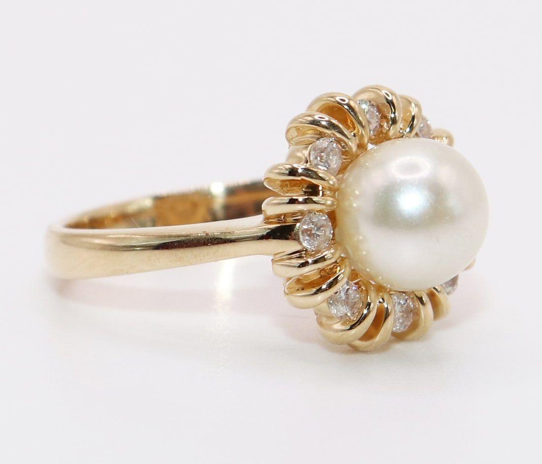 14KT Yellow gold ring with 7.3 MM pearl and (8) diamond accents (H-I color, SI clarity). Size 6 1/4, weighs 5 grams. Marked 14KG CJ