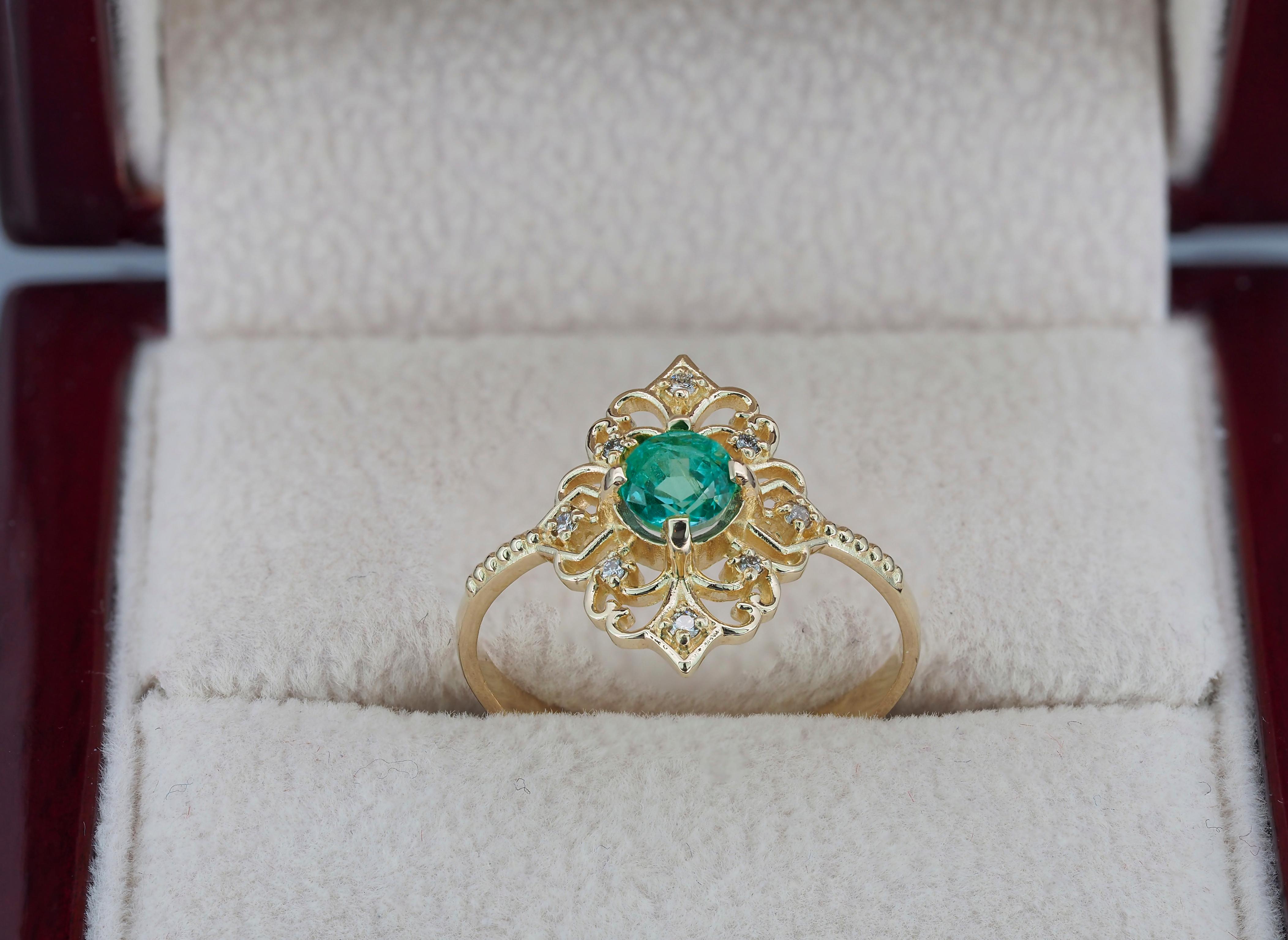 14 kt yellow gold ring with emerald and diamonds are hand made item.
Weight approx. 1.6 g.
Set with emerald, color - bluish green
Round cut, 0.50 ct. in total.
Clarity: Transparent with inclusions

Surrounding stone - diamonds 0.08 (8x0.01) ct