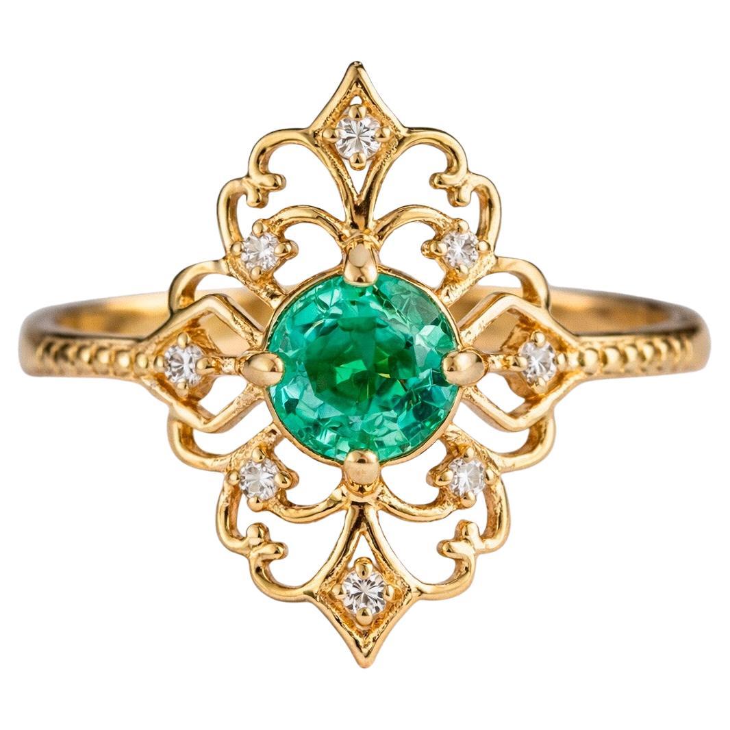 14 K Goldring mit Smaragd und Diamanten
