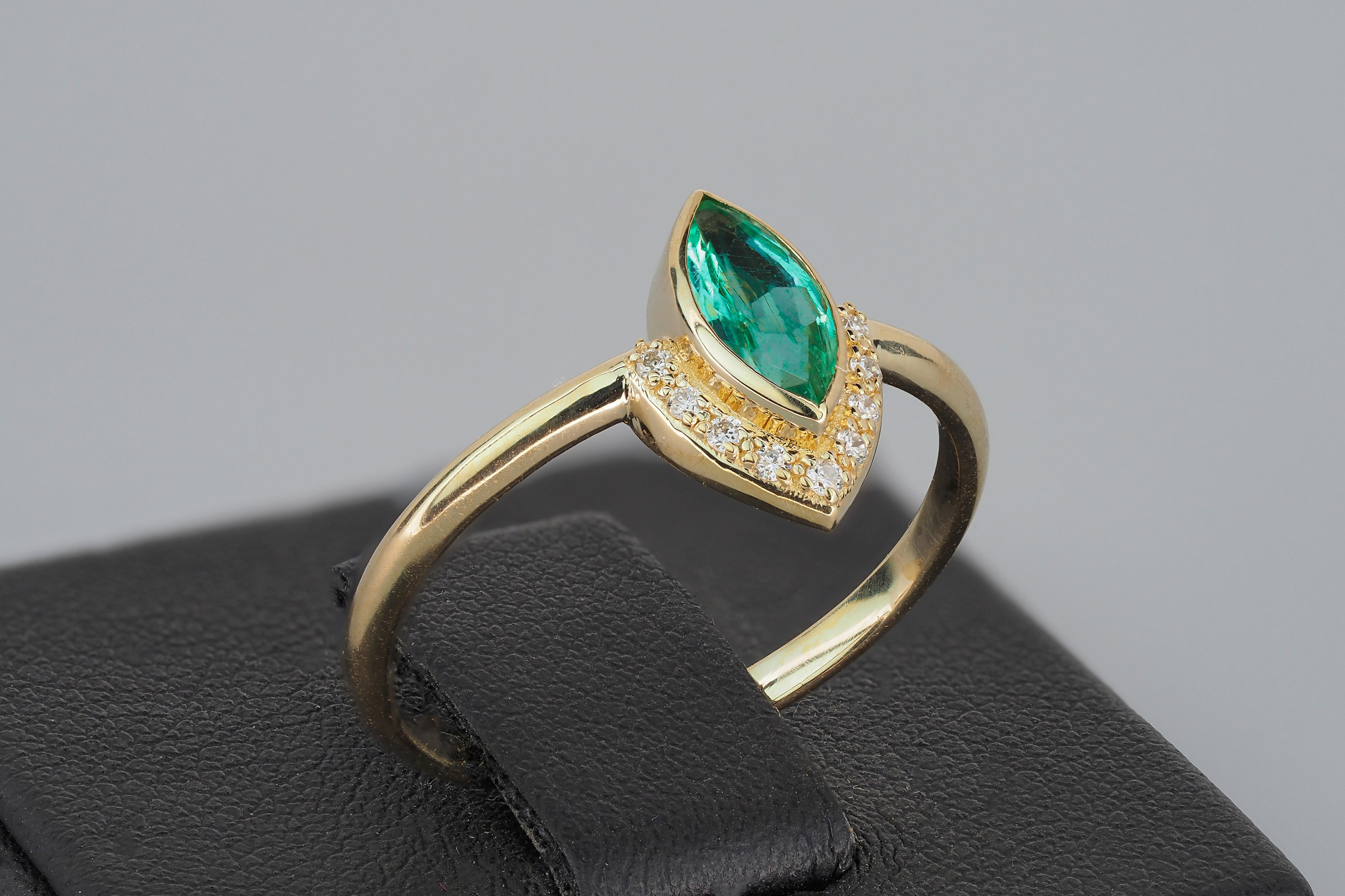 For Sale:  14 K Gold Ring with Marquise Cut Emerald and Diamonds 12