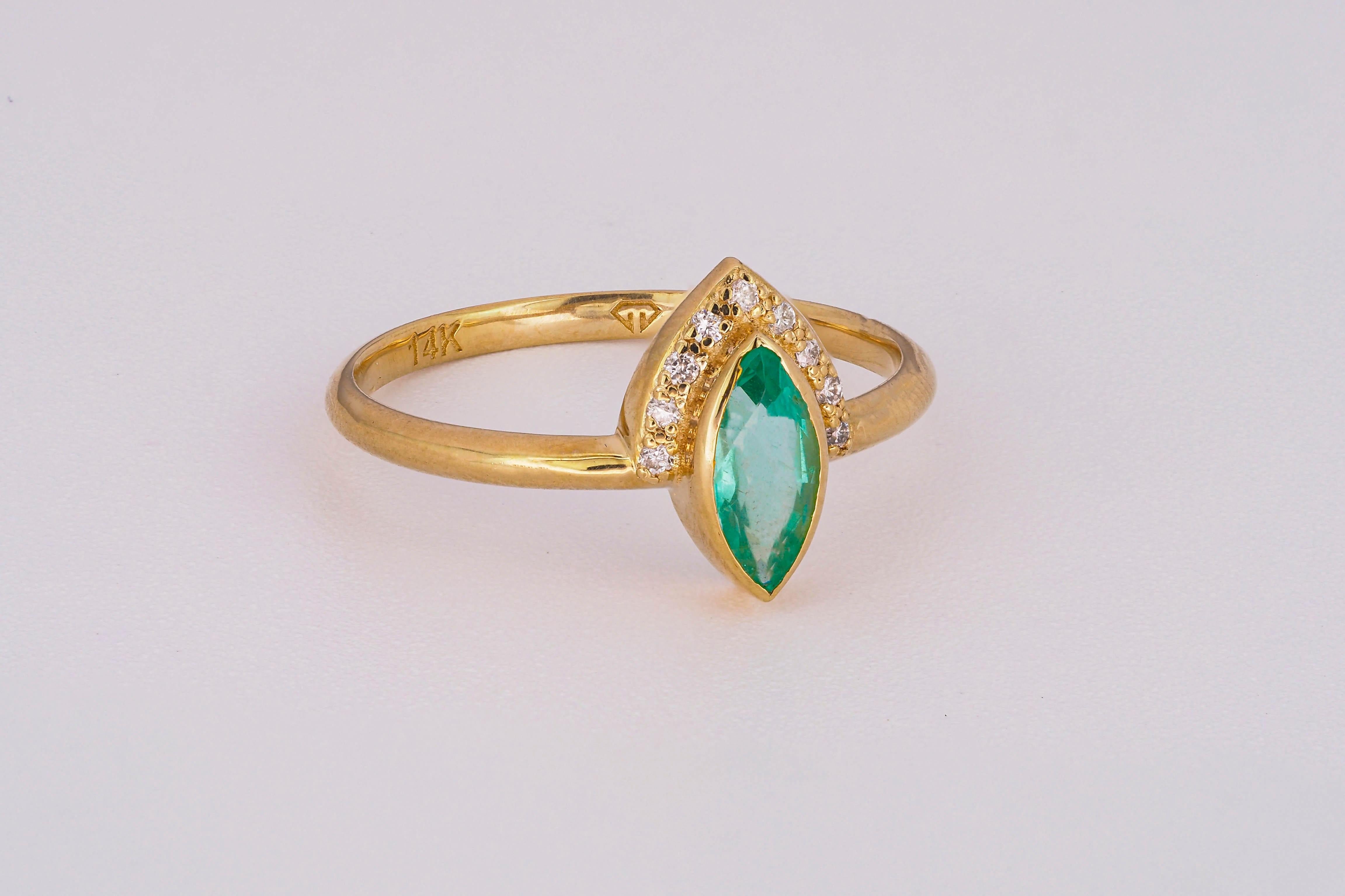 For Sale:  14 K Gold Ring with Marquise Cut Emerald and Diamonds 14