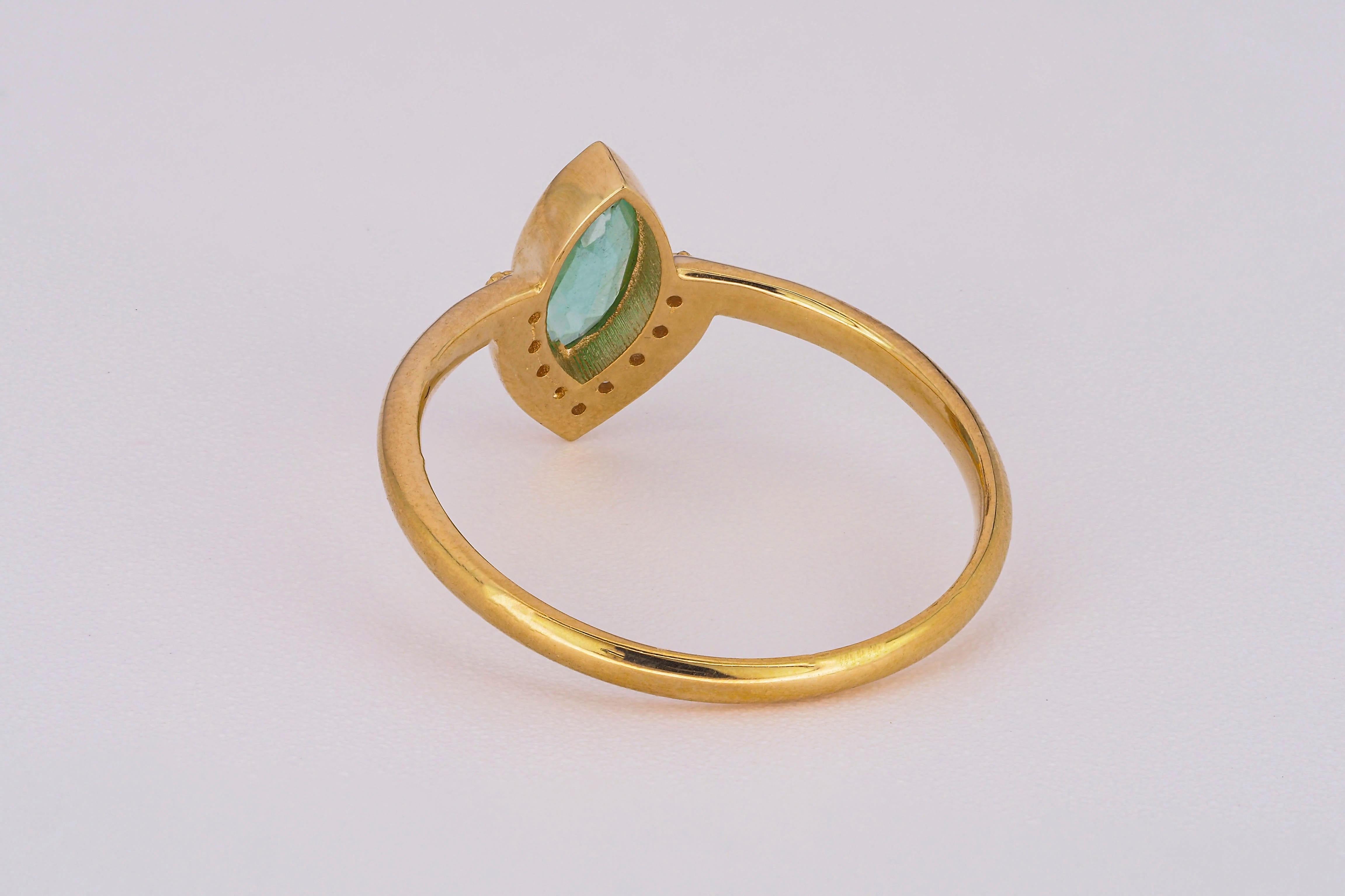 For Sale:  14 K Gold Ring with Marquise Cut Emerald and Diamonds 18