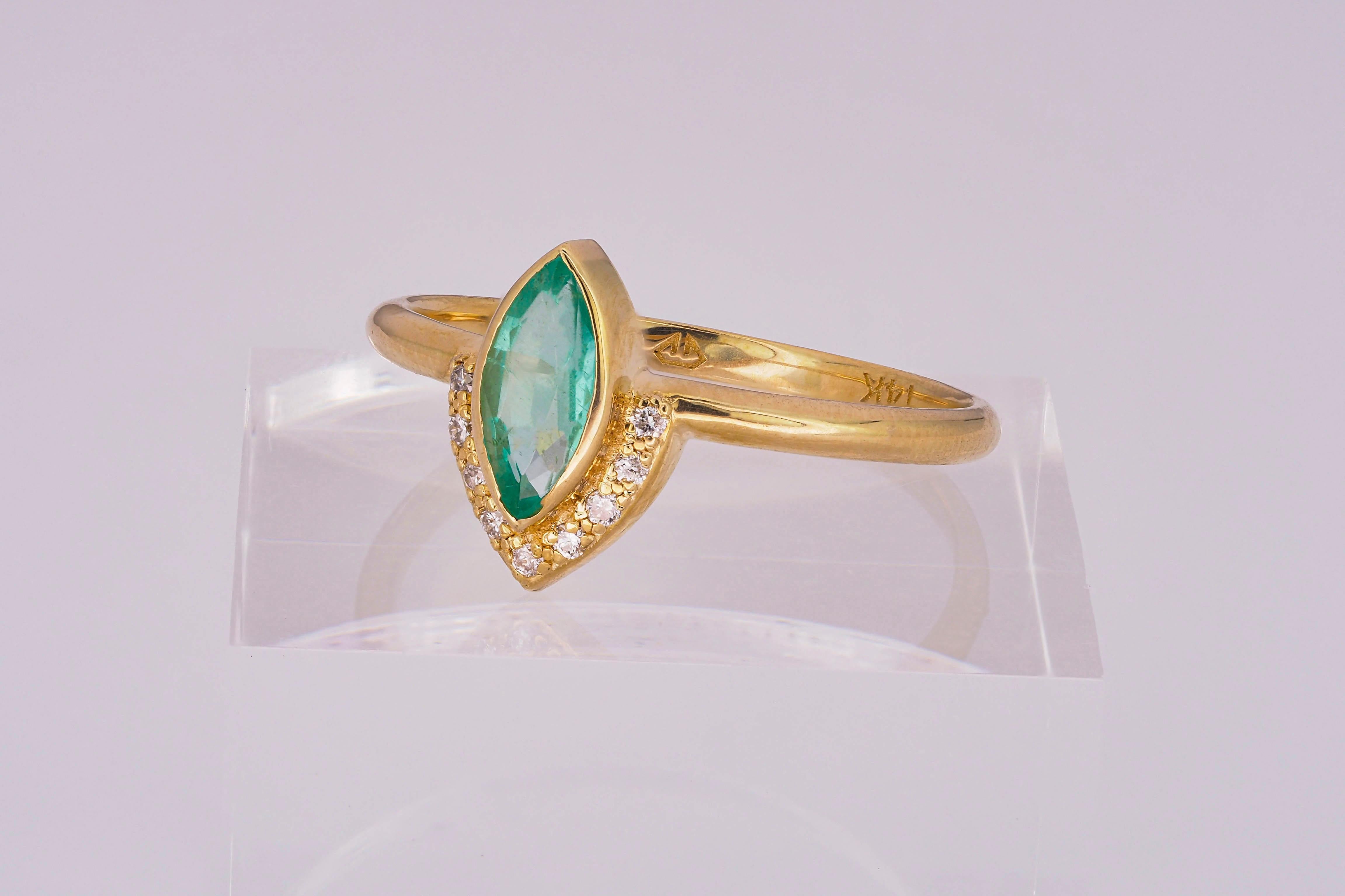 For Sale:  14 K Gold Ring with Marquise Cut Emerald and Diamonds 19