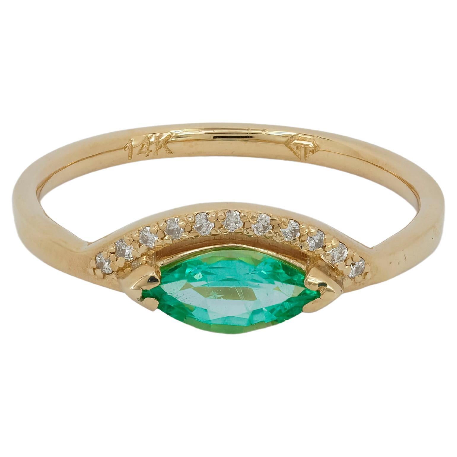For Sale:  14 K Gold Ring with Marquise Cut Emerald and Diamonds