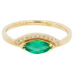 14 K Gold Ring with Marquise Cut Emerald and Diamonds