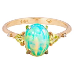 14 k gold ring with opal, peridot, diamonds. 