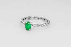 14 K Gold Ring with Oval Emerald and Diamonds