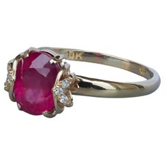 14 Karat Gold Ring with Ruby and Diamonds. Oval ruby ring