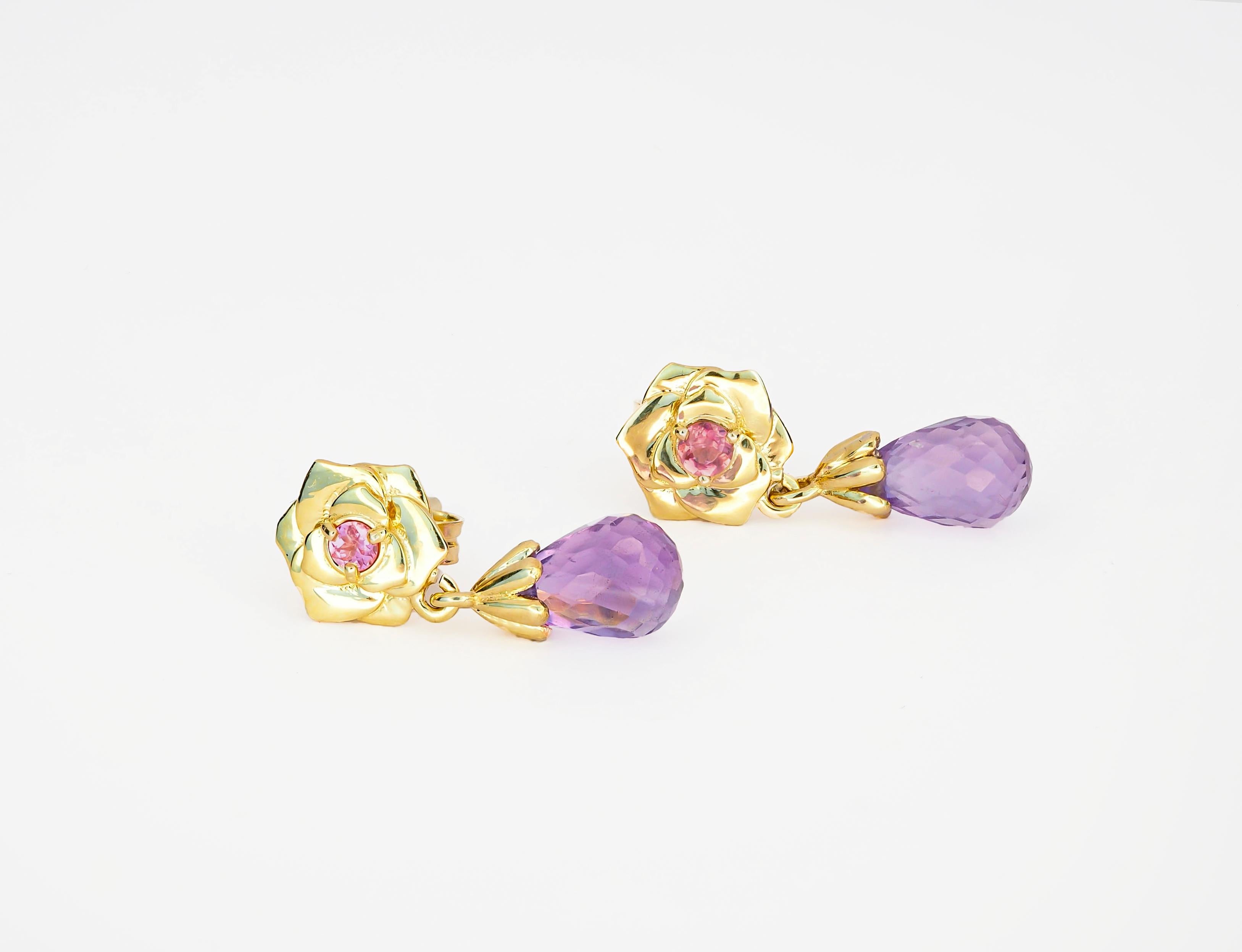 14 kt solid gold earrings with natural amethysts and sapphires. Febrary birthstone.
Weight: 2.45 g.
Earrings Size: 18 x 8 mm.

Main stones: Natural amethysts - 2 pieces (2 pieces x 1.20 ct)
Total weight: 2.40 ct total aprox
Briolette shape, violet