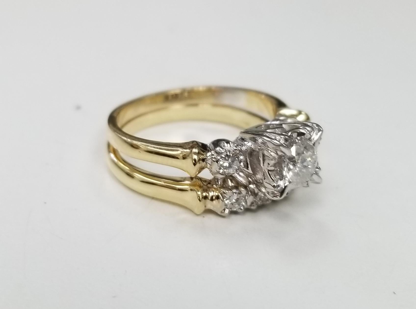 14k 2tone diamond wedding set total weight .64pts., containing 1 brilliant cut diamonds weighing .32pts and 6 round full cut diamonds weighing .32pts. ring size is 6 and can be sized to fit for free.