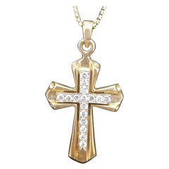 Croix et chaîne en or bicolore 14 carats avec diamants