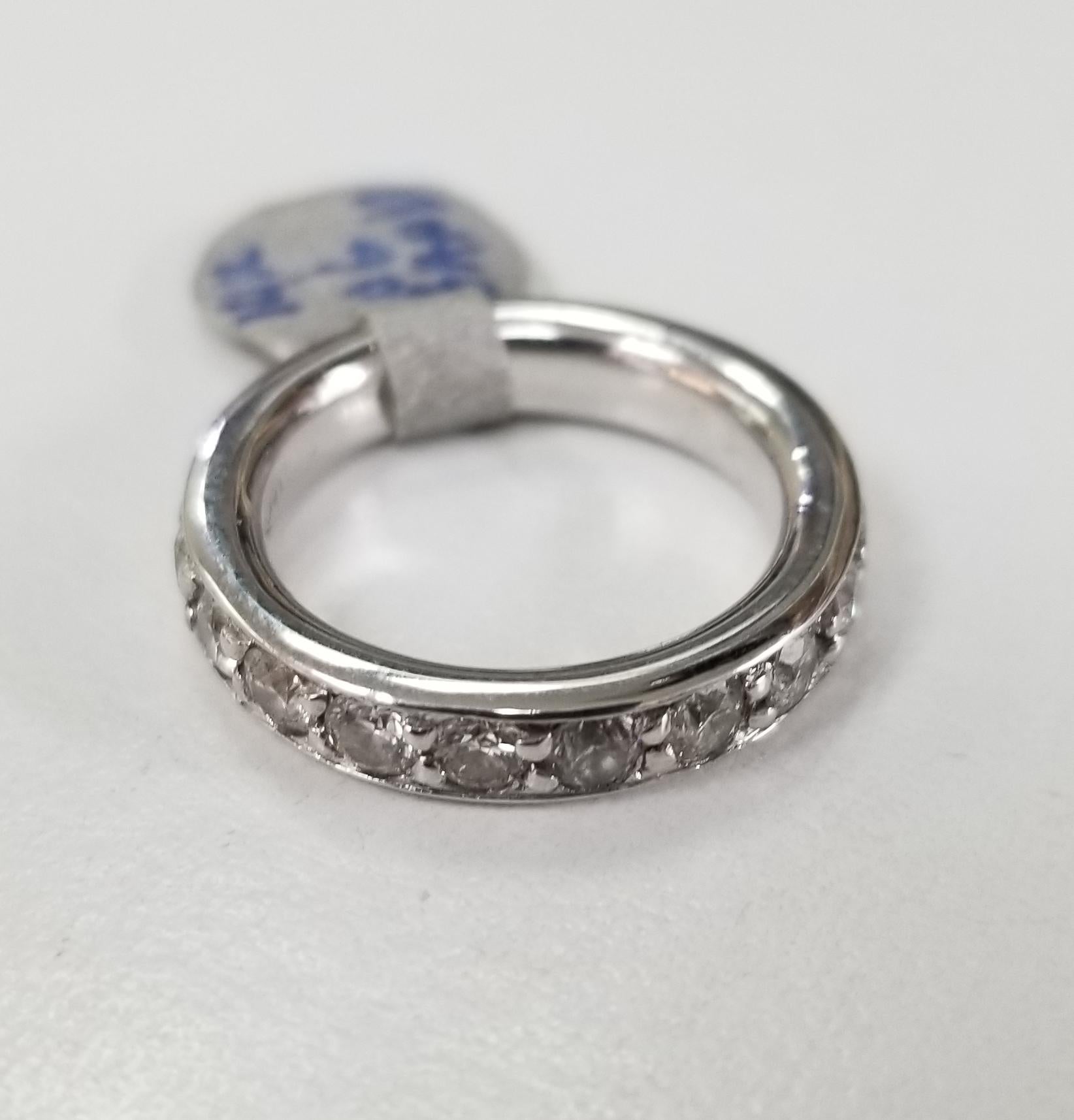 14k white gold 4mm wide and 2.5mm tall Diamond eternity ring with 2.05cts., containing 19 round full cut diamonds of nice quality weighing .2.05cts. ring is a size 4 3/4.