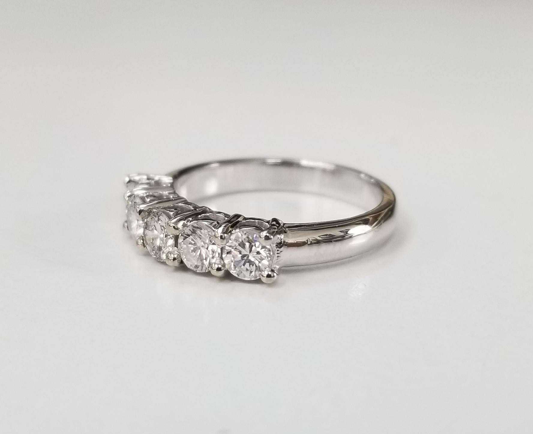 14 karat 5 stone diamond ring weighing .95pts. color 