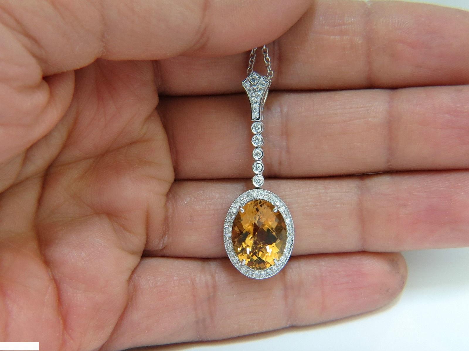7.00ct. Natural Honey color citrine

Brilliant Rose cut.

Clean Clarity

14.2 X 11.3mm

Side diamonds:

.75ct. 

Rounds, full cuts.

G-color, Vs-2 clarity

14kt. white gold

Excellent sparkle 

7.7gms. 

Pendant: 1.6 inches long

Necklace 18 Inches