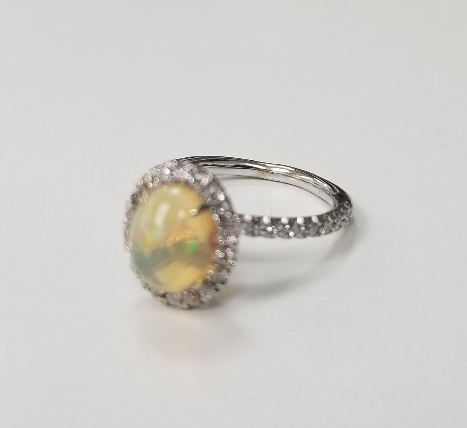14 karat African Opal and diamond ring, containing 38 round full cut diamonds of very fine quality weighing .45pts. ring size is 4.5 and can be sized to fit.