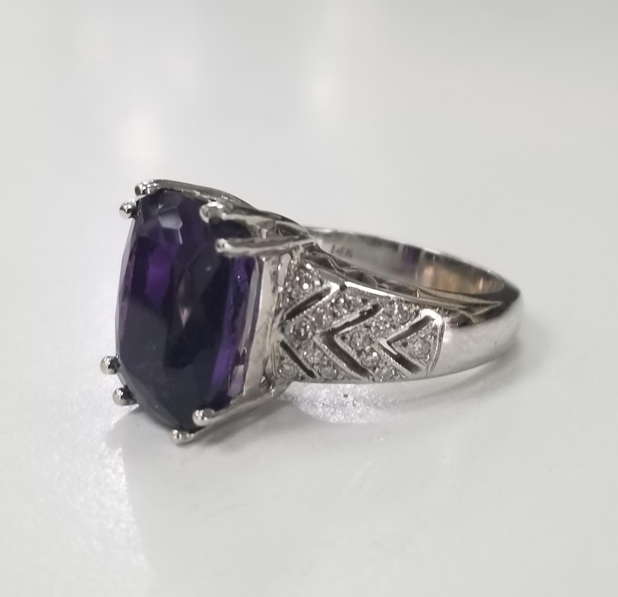 14k yellow gold Amethyst and diamond ring, containing 1 cushion cut amethyst weighing 7.94cts. and 26 round full cut diamonds of nice quality weighing .42pts. 
