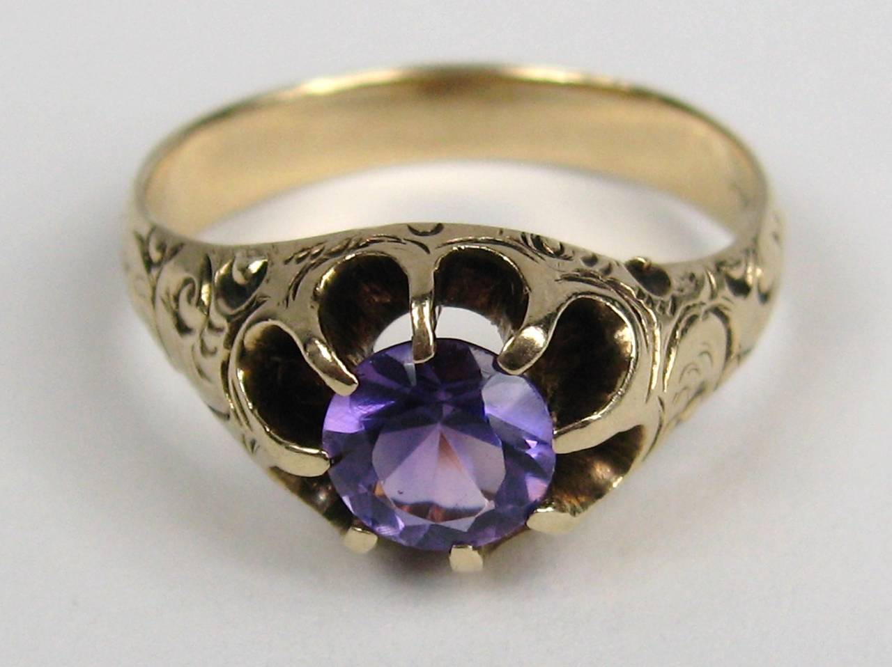 Stunning center Amethyst Stone set in a 14K Gold Claw prong Ring. Approximately 1.03 carats. The Ring is a size 9 and can be sized by your jeweler or by us. Unisex for sure. This is out of a massive collection of New Old stock items as well as 