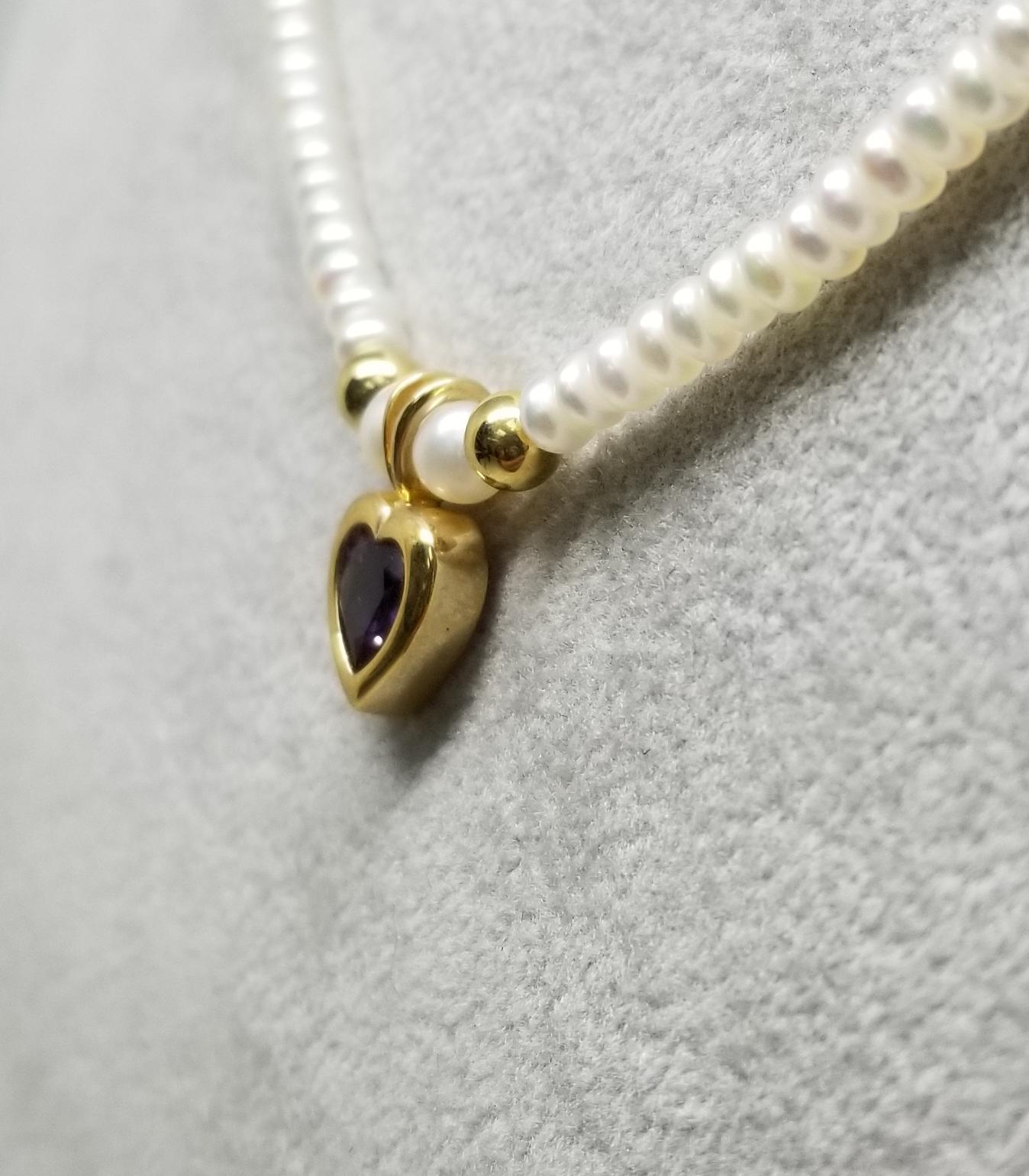 14 karat Amethyst 1.00cts. Heart necklace on 3mm Pearls 16 inches.