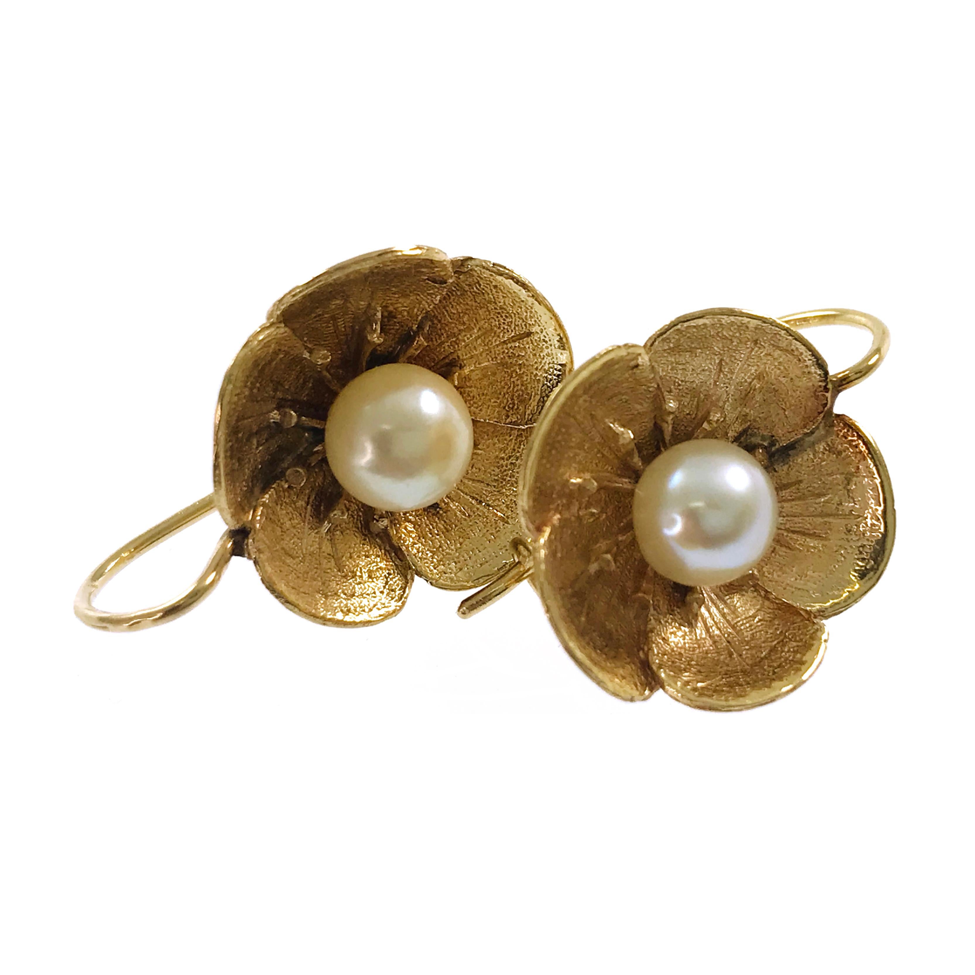 14 Karat Flower Pearl Earrings. These antique earrings are darling and delicate with a textured front and smooth back and a center pearl. 6mm Pearls are AA grade: Color range - white, creamy; clean; good shape; good luster. Stamped on the back of