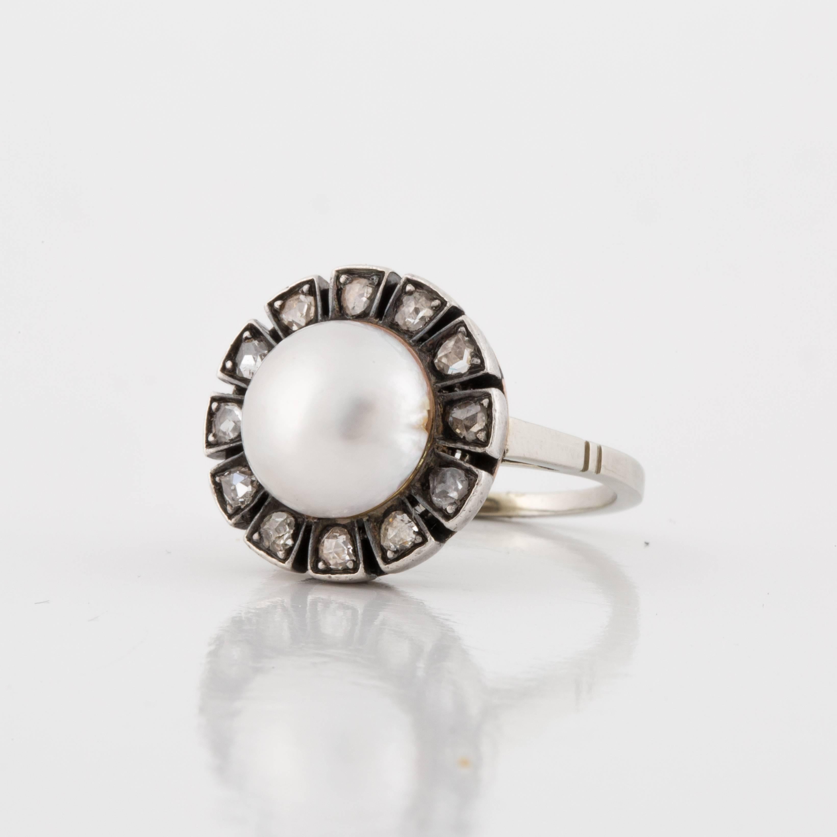 Mabe' pearl diamond ring from the 1930's.  Features a Mabe' pearl in the center surrounded by twelve (12) rose cut diamonds.  Ring is a size 5-3/4 and it measures 5/8