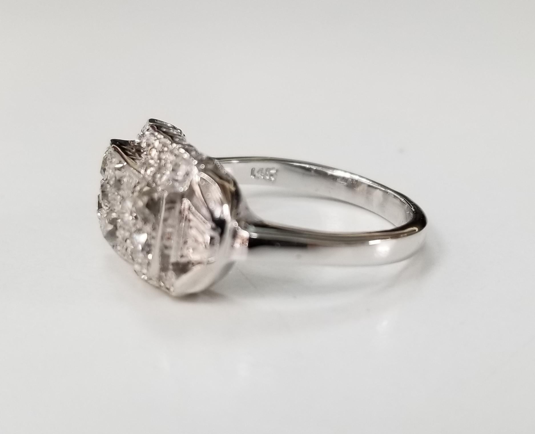 14 karat Art Deco Style diamond filigree ring, containing 16 rose and single cut diamonds of good quality weighing .65pts. ring is 6 and can be size to fit for free.
