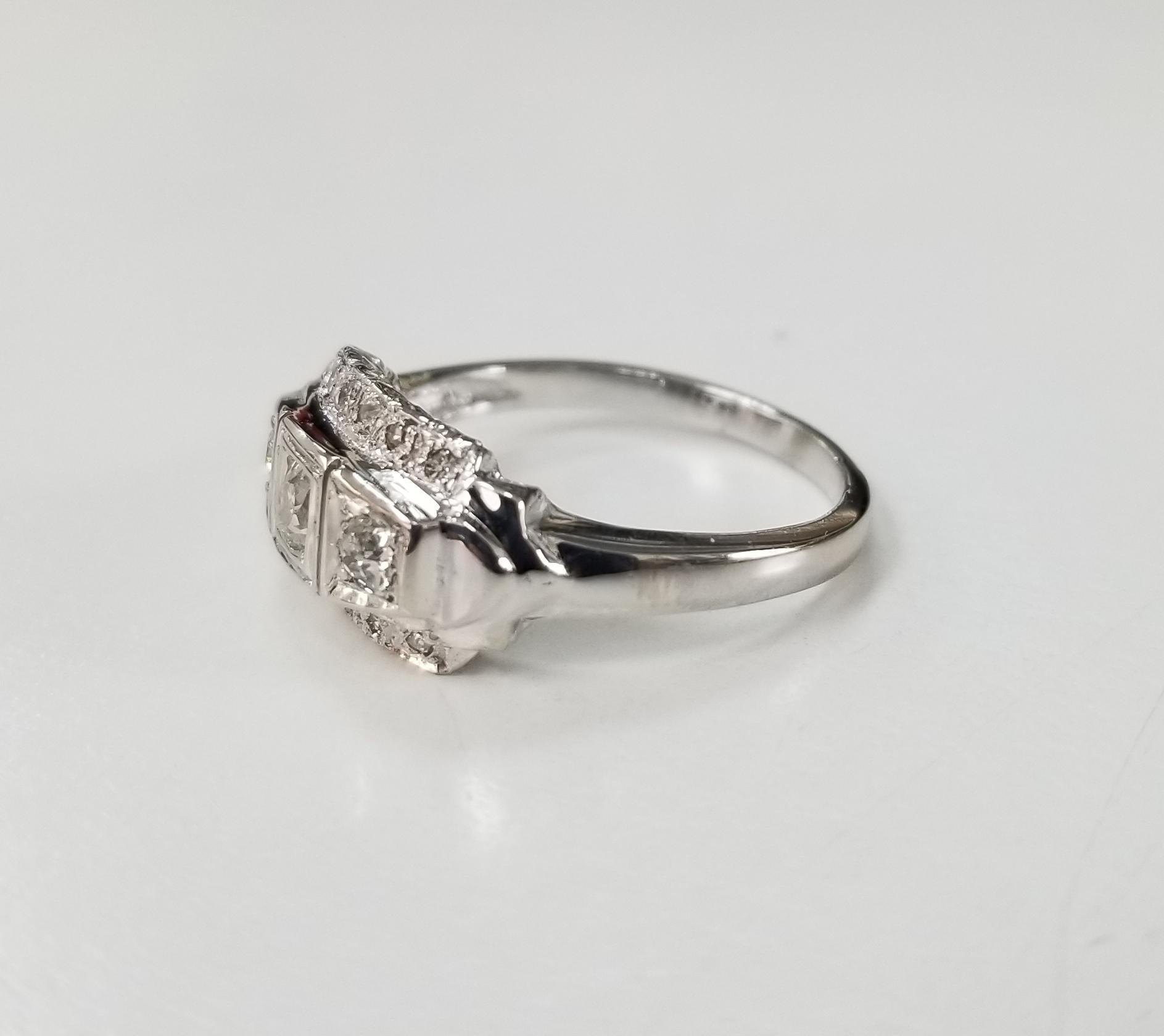 14 karat Art Deco Style diamond filigree ring, containing 27 rose and single cut diamonds of good quality weighing .55pts. ring is 6.25 and can be size to fit for free.
