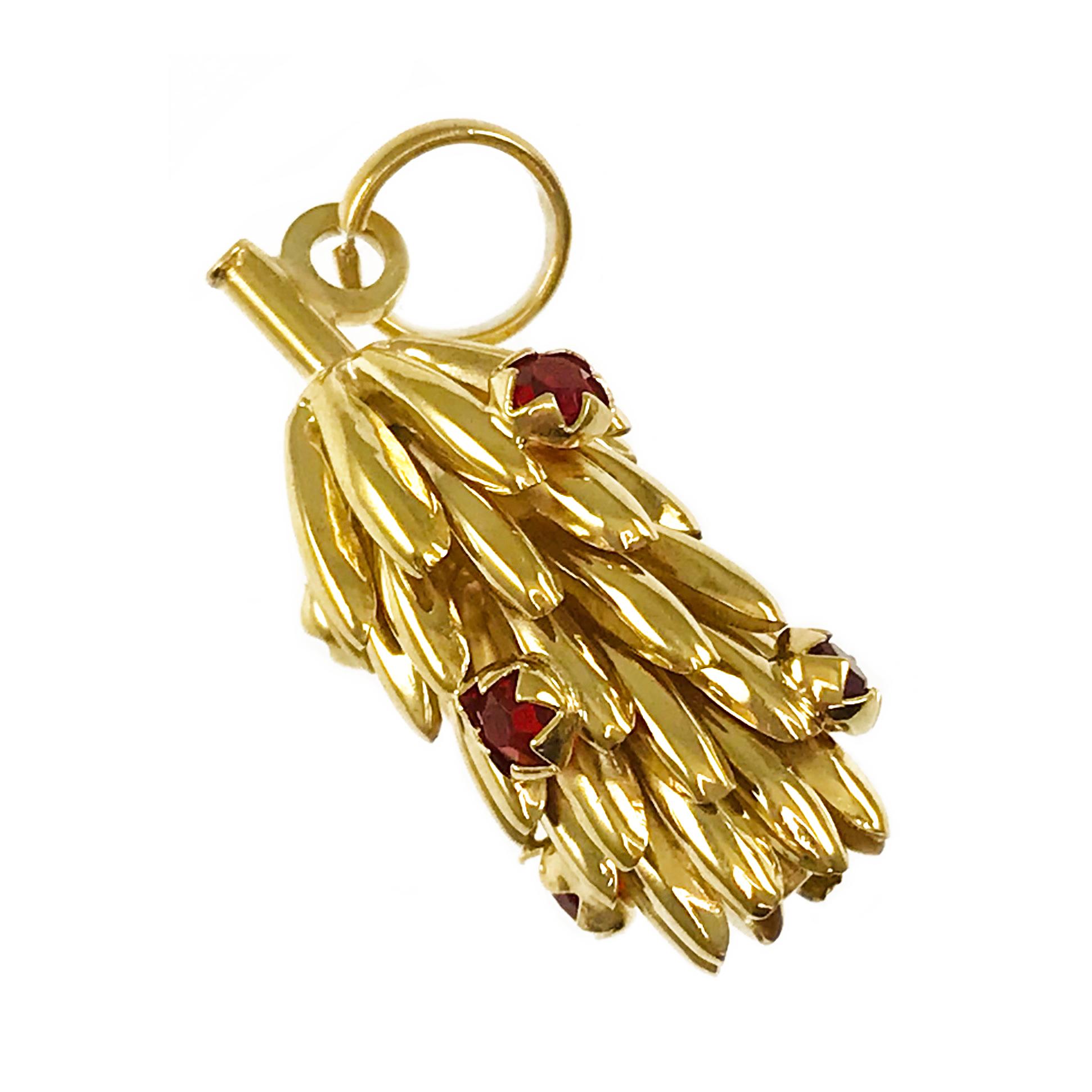 14 Karat Banana Bunch Pendant. This lovely excellently-crafted pendant/charm features five Red-orange bezel-set stones. The pendant measures 10.54mm wide x 25.4mm tall. Stamped on the jump ring is 14K. The total gold weight of the pendant is 3.3