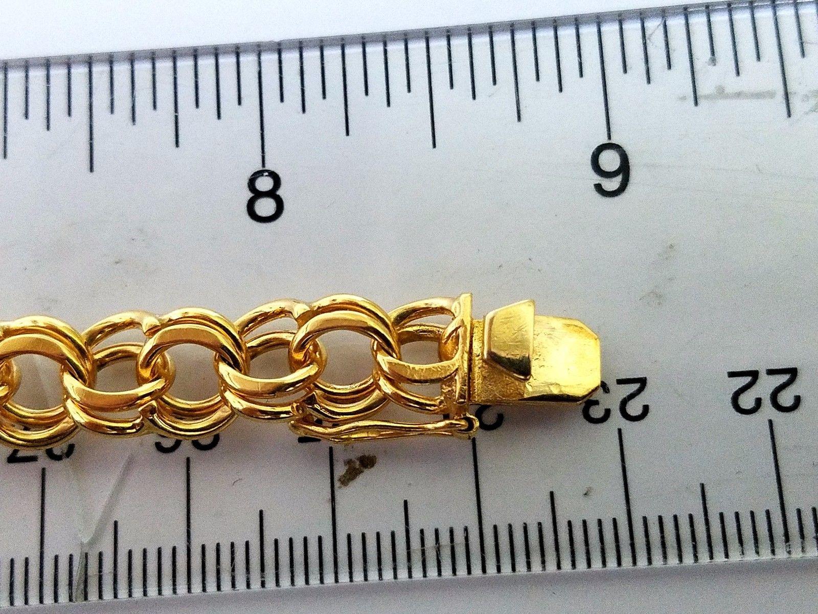 Double Loop Linked Bracelet.

Solid, made for charms support.

14kt. yellow Gold

27 grams

8.5 inches long

9.0mm wide

Very durable and substantial weight

nice sized lock