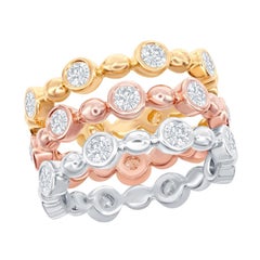 Bagues en or blanc, jaune et rose 14 carats serties de diamants en serti clos